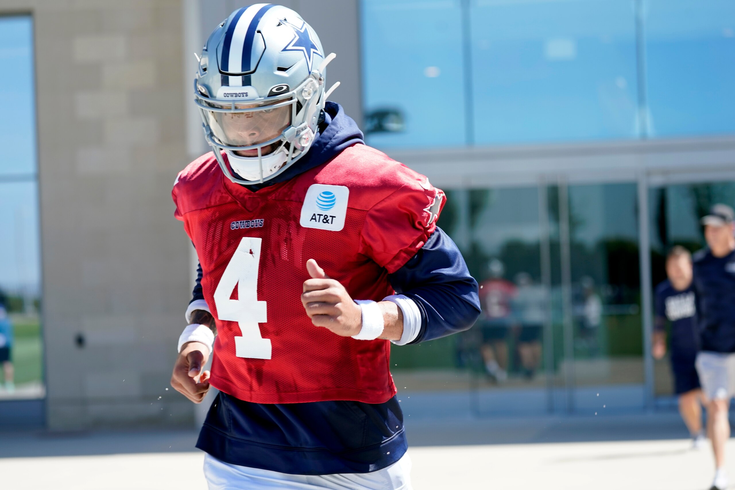 Dallas Cowboys quarterback Dak Prescott (4) jogs out onto the field for practice at the team's NFL football training facility in Frisco, Texas, Thursday, Sept. 23, 2021. (AP Photo/Tony Gutierrez) Dallas Cowboys quarterback Dak Prescott (4) jogs out onto the field for practice at the team's NFL football training facility in Frisco, Texas, Thursday, Sept. 23, 2021. (AP Photo/Tony Gutierrez)