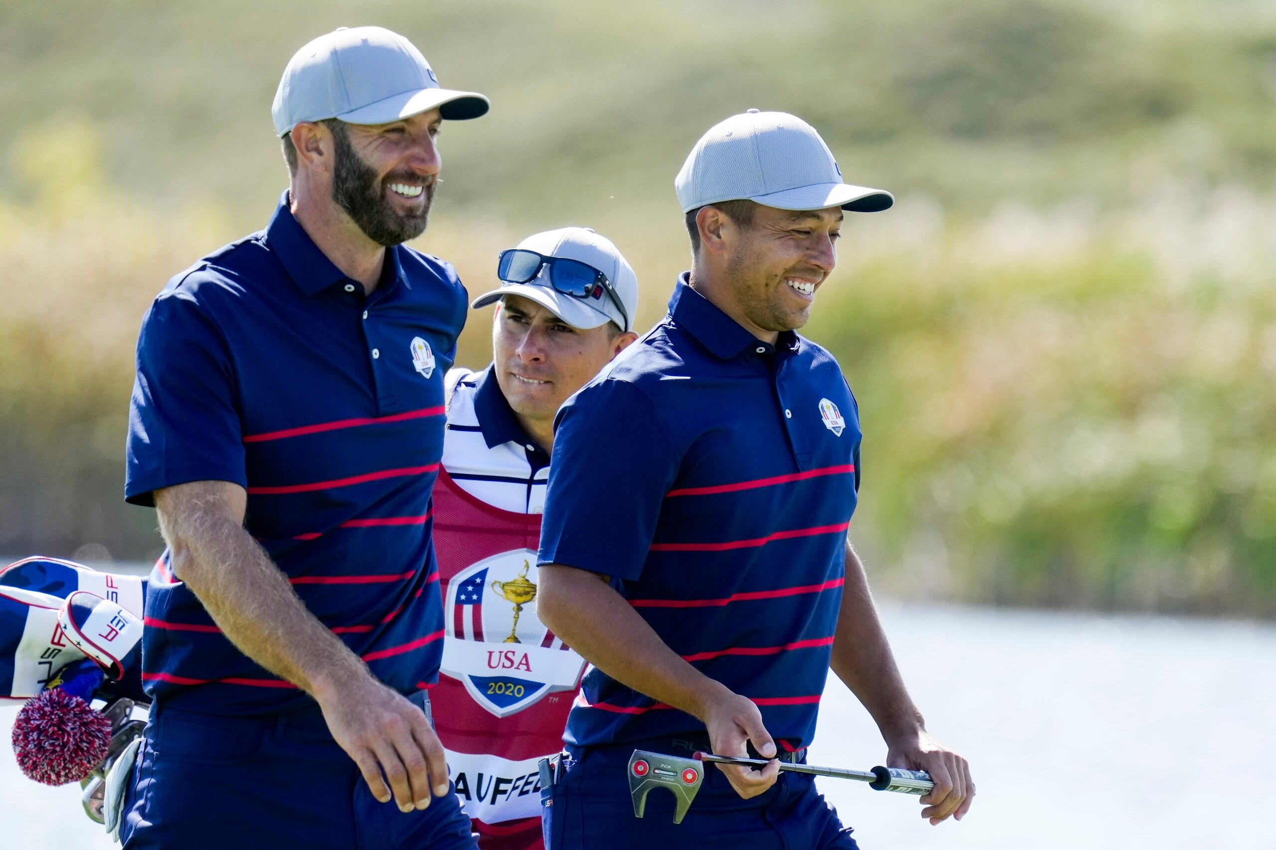 Team USA's Dustin Johnson and Team USA's Xander Schauffele smile as they walk up the fifth hole during a four-ball match the Ryder Cup at the Whistling Straits Golf Course Friday, Sept. 24, 2021, in Sheboygan, Wis. (AP Photo/Ashley Landis) Team USA's Dustin Johnson and Team USA's Xander Schauffele smile as they walk up the fifth hole during a four-ball match the Ryder Cup at the Whistling Straits Golf Course Friday, Sept. 24, 2021, in Sheboygan, Wis. (AP Photo/Ashley Landis)