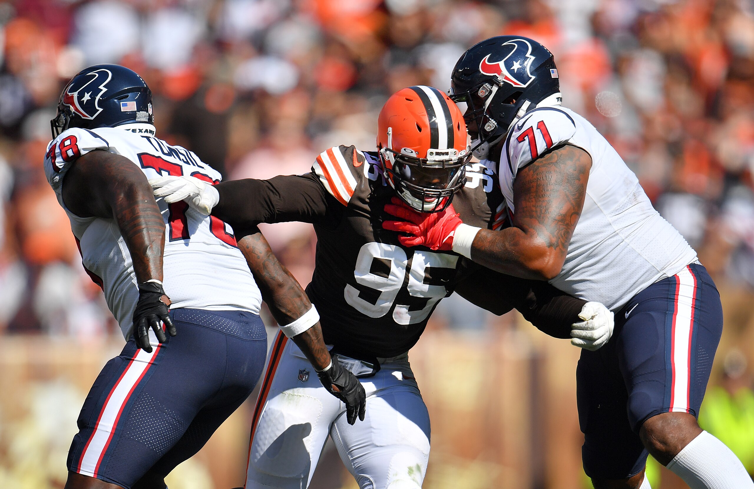 CLEVELAND, OHIO - SEPTEMBER 19: Defensive end Myles Garrett #95 of the Cleveland Browns battles offensive tackle Laremy Tunsil #78 and offensive tackle Tytus Howard #71 of the Houston Texans during the second half at FirstEnergy Stadium on September 19, 2021 in Cleveland, Ohio. (Photo by Jason Miller/Getty Images)