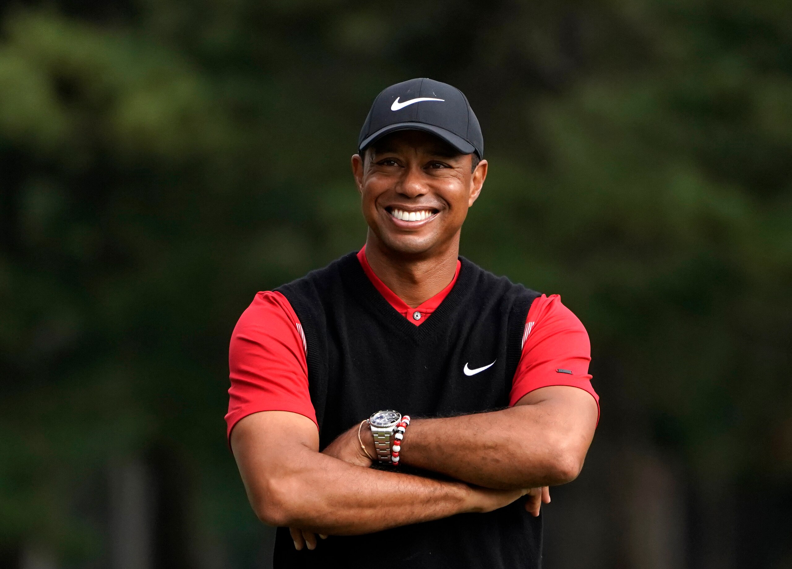 FILE - In this Oct. 28, 2019, file photo, Tiger Woods smiles during the winner's ceremony after winning the Zozo Championship PGA Tour at the Accordia Golf Narashino country club in Inzai, east of Tokyo, Japan. A man who found Woods unconscious in a mangled SUV last week after the golf star who later told sheriff's deputies he did not know how the collision occurred and didn't even remember driving, crashed the vehicle in Southern California, authorities said in court documents. Law enforcement has not previously disclosed that Woods had been unconscious following the collision.  (AP Photo/Lee Jin-man, File)
