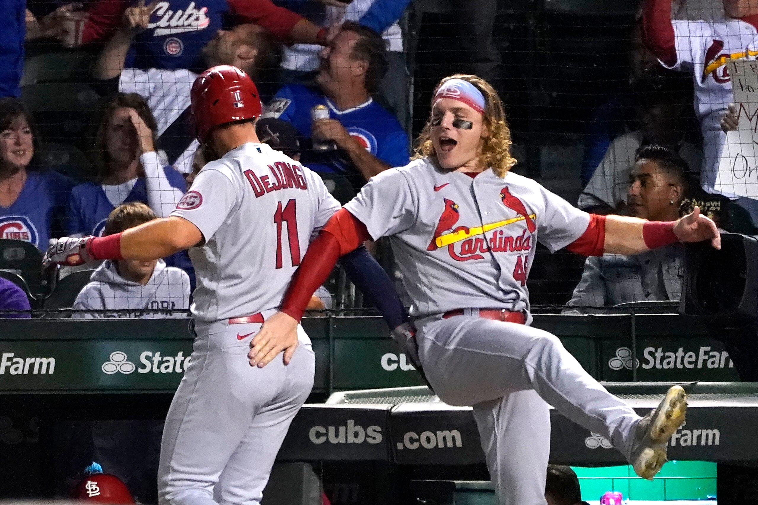 St. Louis Cardinals' Paul DeJong (11) celebrates his home run off Chicago Cubs relief pitcher Michael Rucker with Harrison Bader, during the third inning of a baseball game Friday, Sept. 24, 2021, in Chicago. (AP Photo/Charles Rex Arbogast)