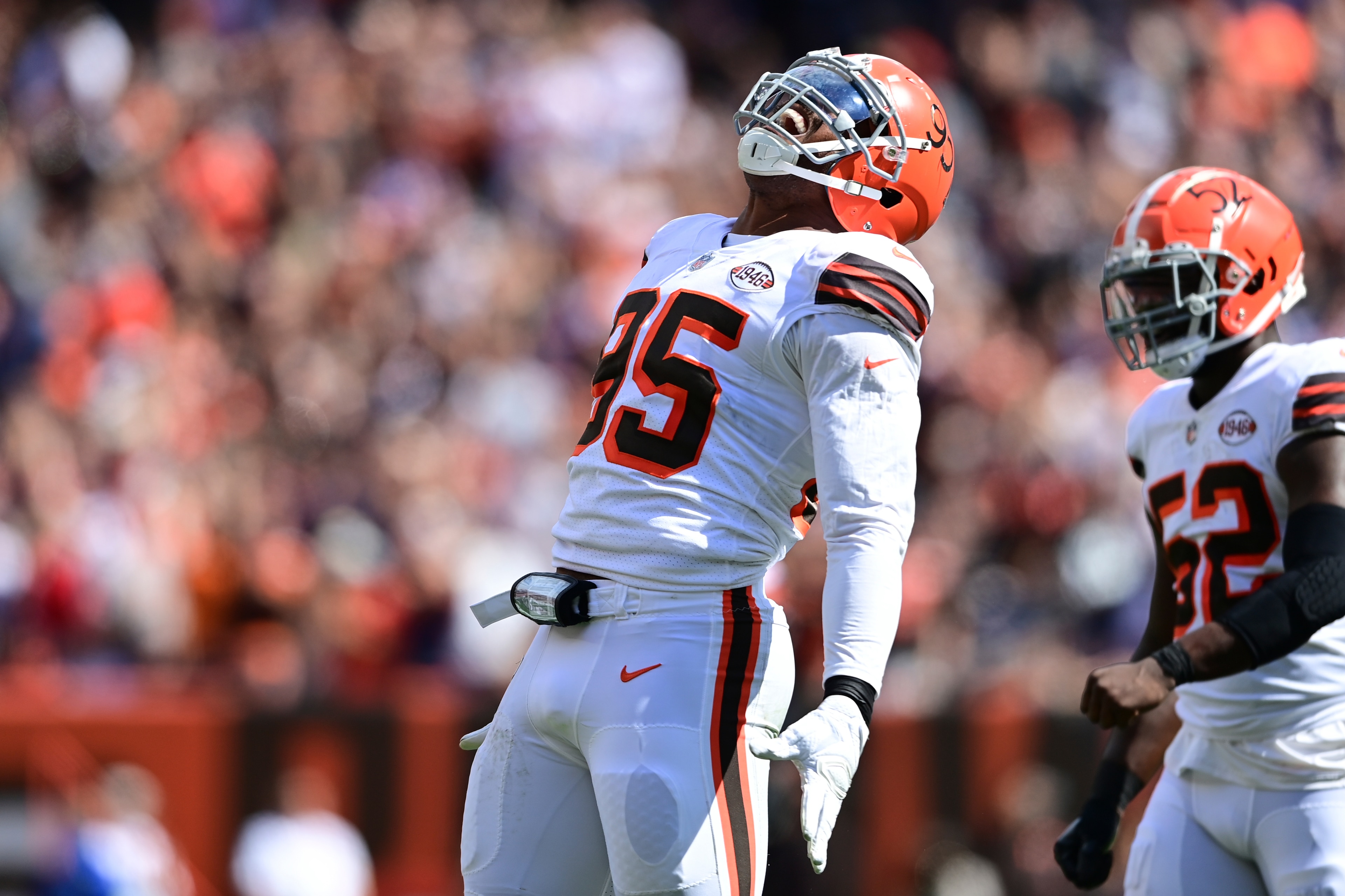 Cleveland Browns defensive end Myles Garrett (95) celebrates a sack during the first half of an NFL football game against the Chicago Bears, Sunday, Sept. 26, 2021, in Cleveland. (AP Photo/David Dermer)