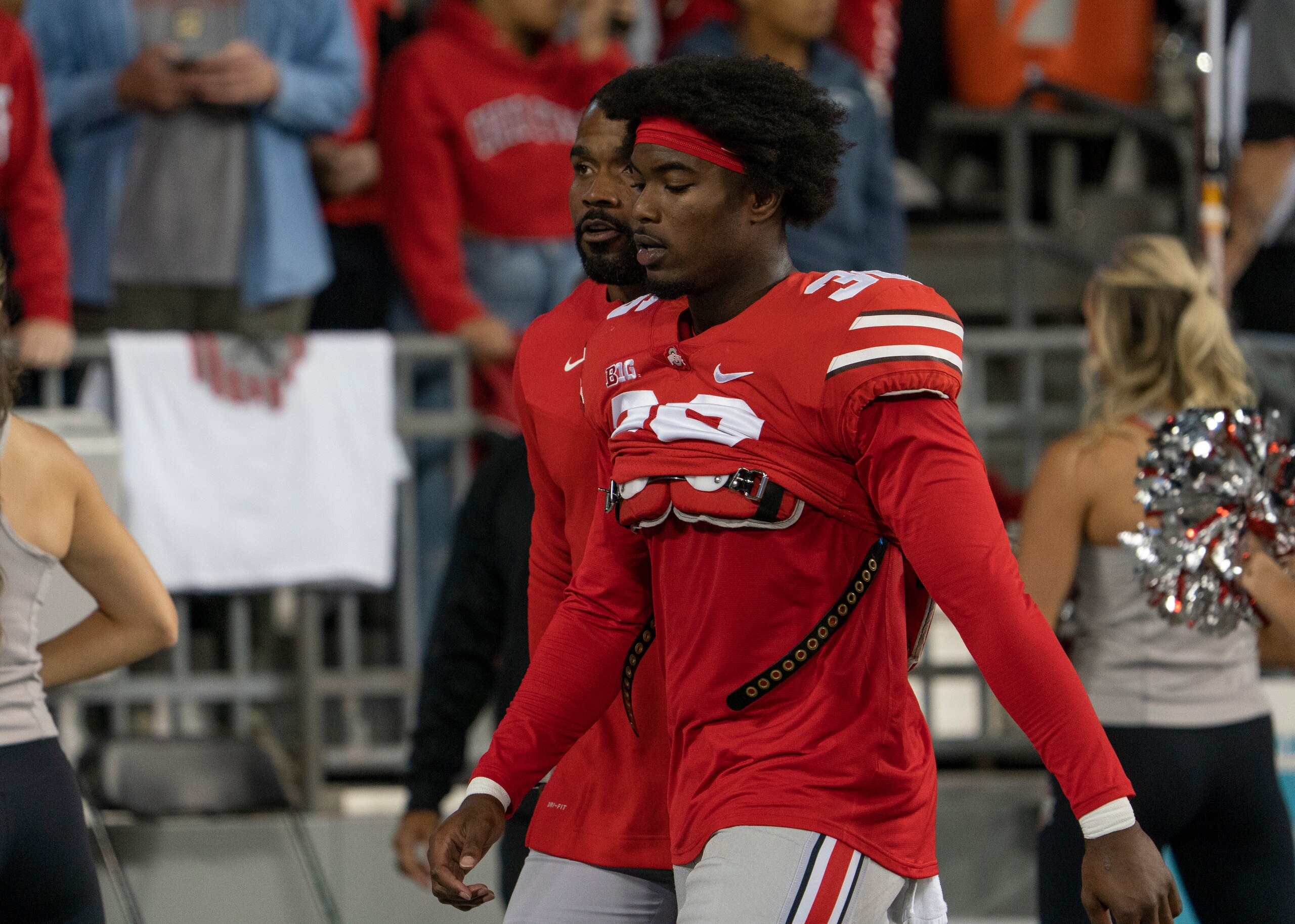 COLUMBUS, OH - SEPTEMBER 25: Ohio State Buckeyes linebacker K'Vaughan Pope #36 being escorted out of the game by Ohio State Buckeyes Director Of Player Development C.J. Barnett during the game between the Ohio State Buckeyes and the Akron Zips at Ohio Stadium in Columbus, Ohio on September 25, 2021. (Photo by Jason Mowry/Icon Sportswire via Getty Images)