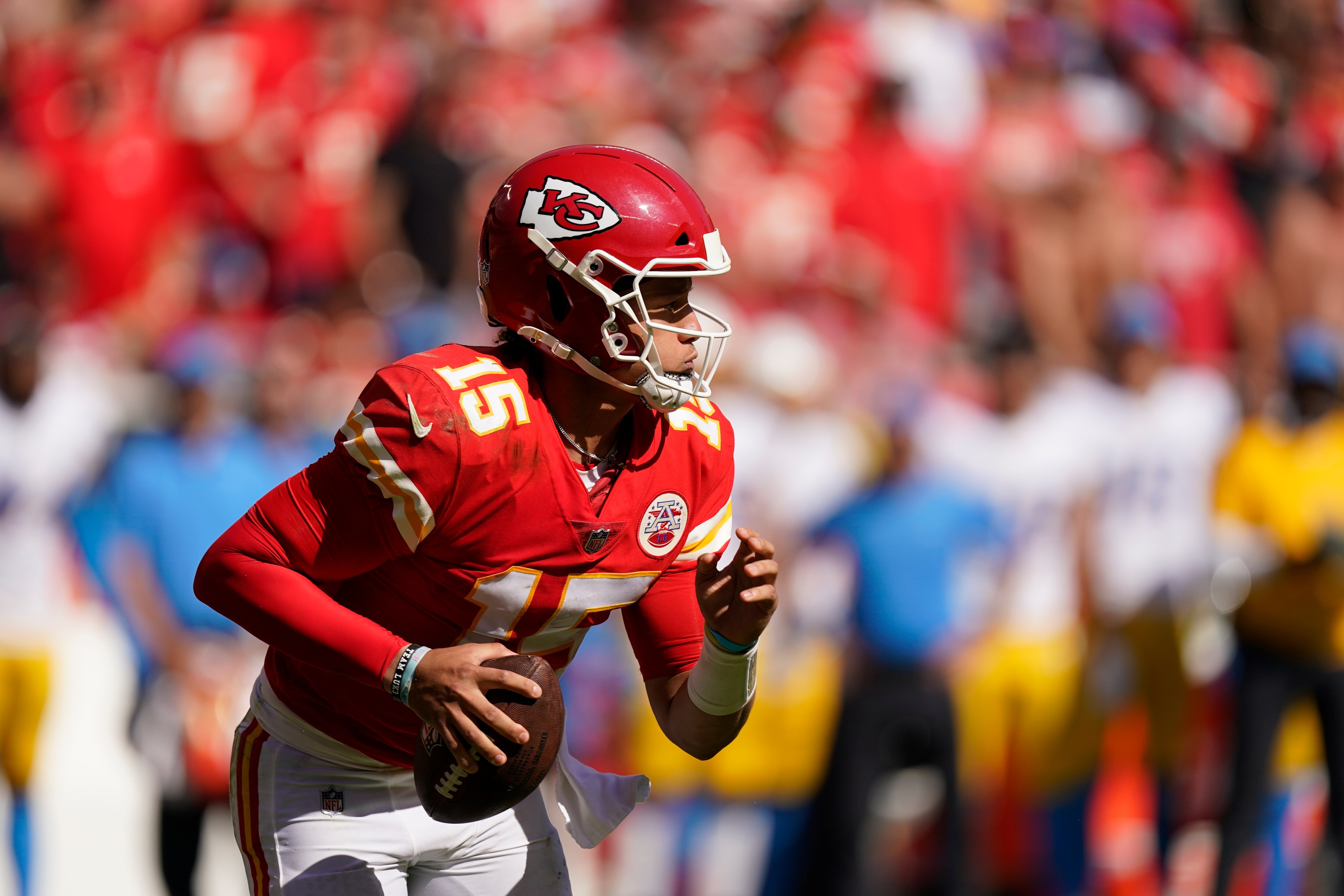 Kansas City Chiefs quarterback Patrick Mahomes (15) looks rtf throw during the second half of an NFL football game against the Los Angeles Chargers, Sunday, Sept. 26, 2021, in Kansas City, Mo. (AP Photo/Charlie Riedel)