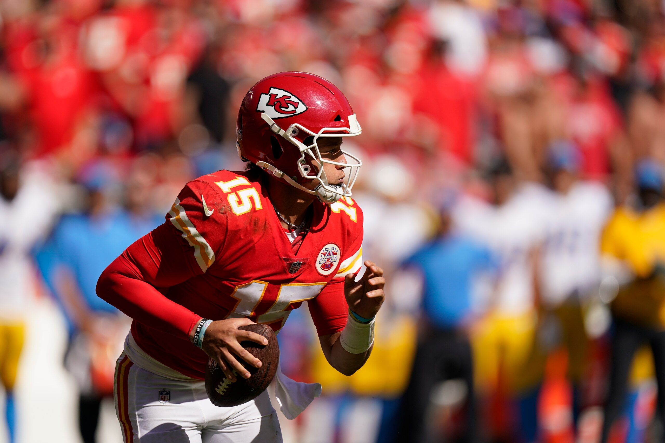 Kansas City Chiefs quarterback Patrick Mahomes (15) looks rtf throw during the second half of an NFL football game against the Los Angeles Chargers, Sunday, Sept. 26, 2021, in Kansas City, Mo. (AP Photo/Charlie Riedel)