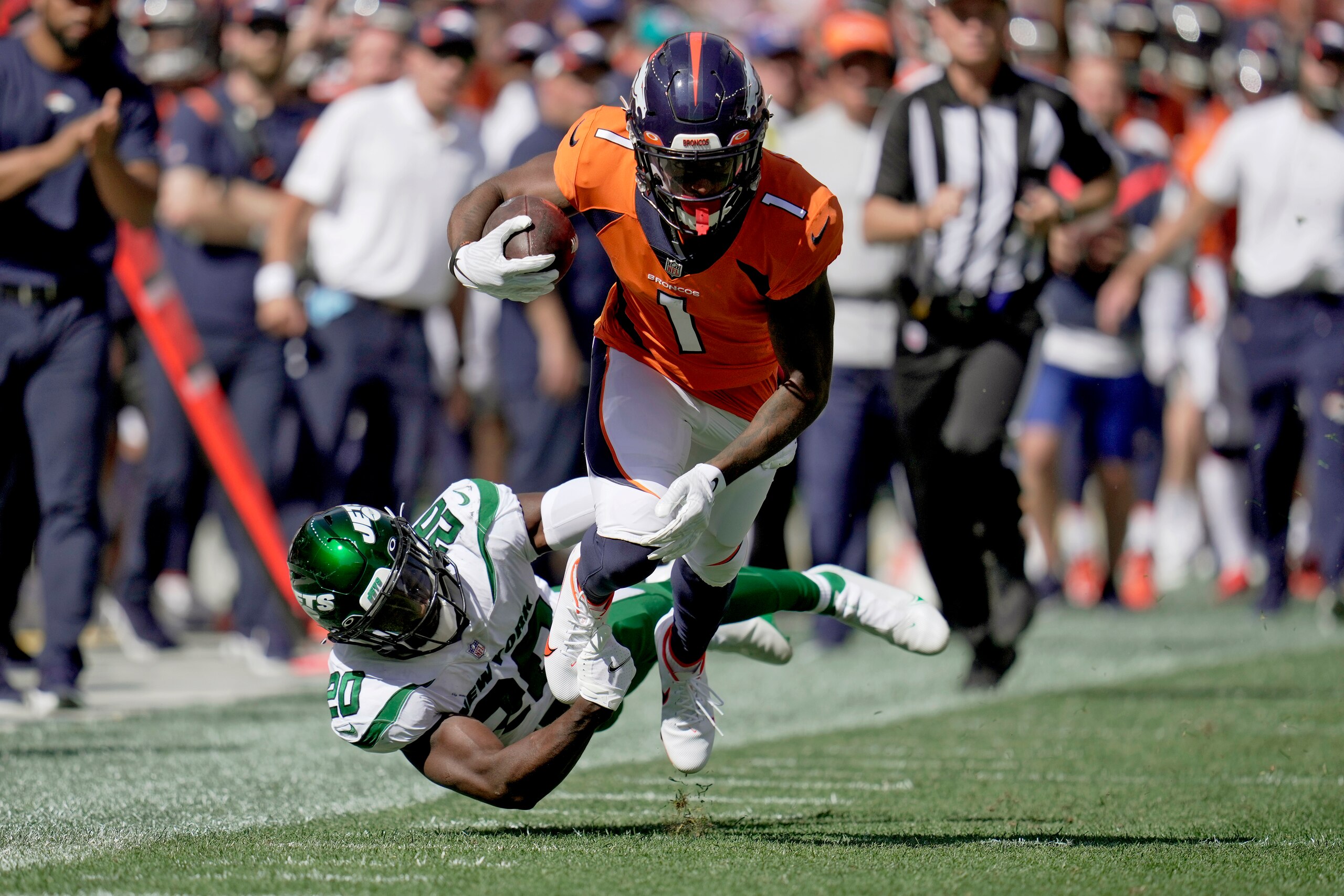 Denver Broncos wide receiver K.J. Hamler (1) is tackled by New York Jets free safety Marcus Maye (20) during the first half of an NFL football game, Sunday, Sept. 26, 2021, in Denver. (AP Photo/Jack Dempsey)