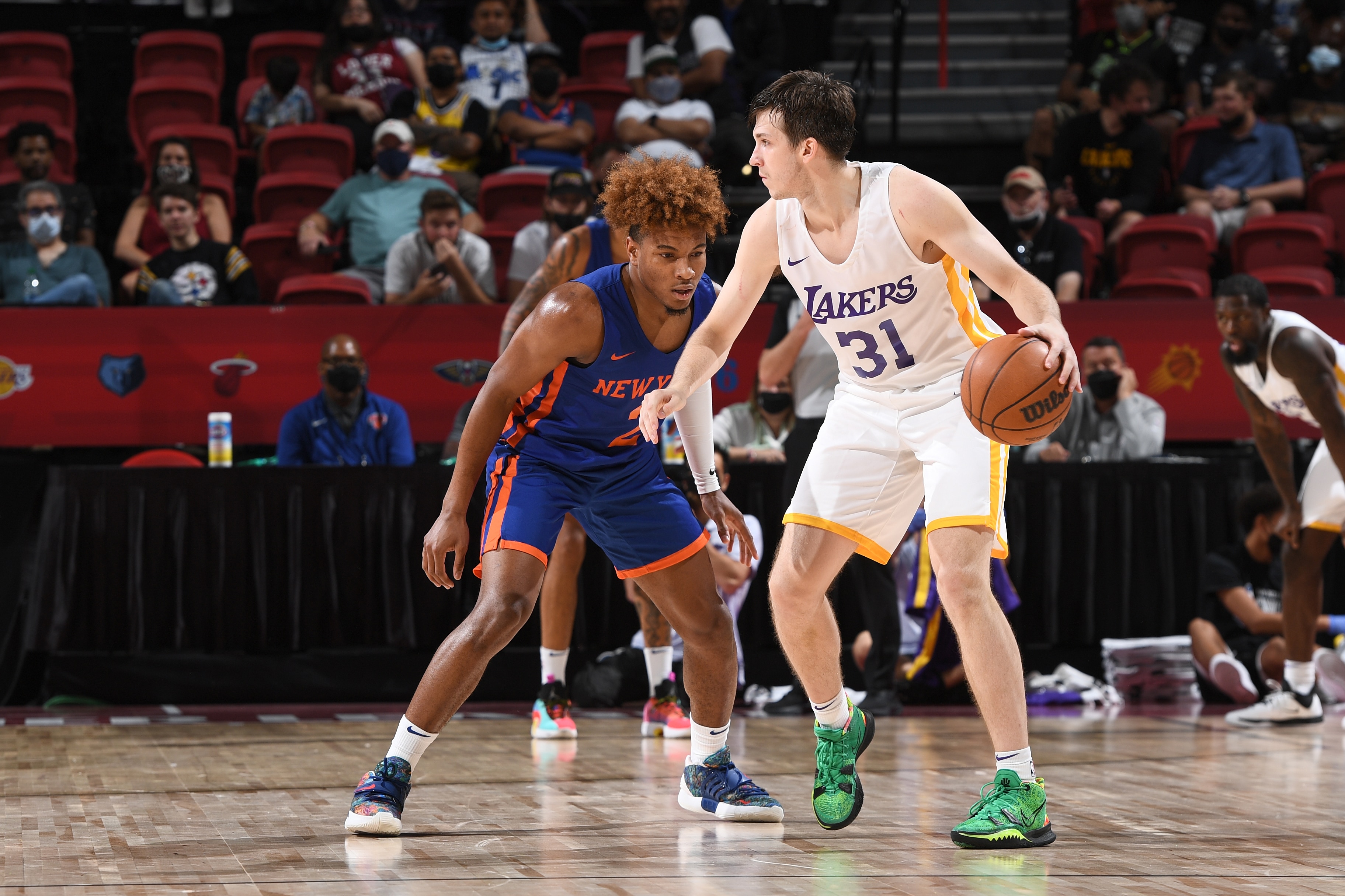 LAS VEGAS, NV - AUGUST 11: Austin Reaves #31 of the Los Angeles Lakers dribbles during the game against the New York Knicks during the 2021 Las Vegas Summer League on August 11, 2021 at the Thomas & Mack Center in Las Vegas, Nevada. NOTE TO USER: User expressly acknowledges and agrees that, by downloading and/or using this Photograph, user is consenting to the terms and conditions of the Getty Images License Agreement. Mandatory Copyright Notice: Copyright 2021 NBAE (Photo by Garrett Ellwood/NBAE via Getty Images)