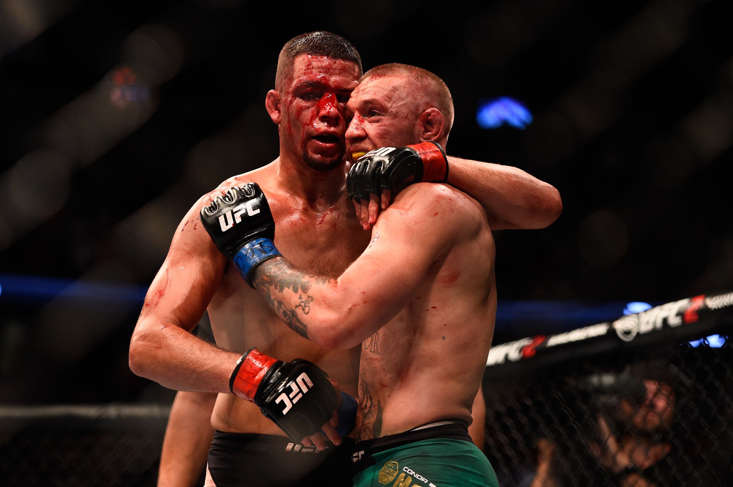 LAS VEGAS, NV - AUGUST 20:  (L-R) Nate Diaz and Conor McGregor of Ireland embrace after finishing five rounds in their welterweight bout during the UFC 202 event at T-Mobile Arena on August 20, 2016 in Las Vegas, Nevada. (Photo by Jeff Bottari/Zuffa LLC/Zuffa LLC via Getty Images)