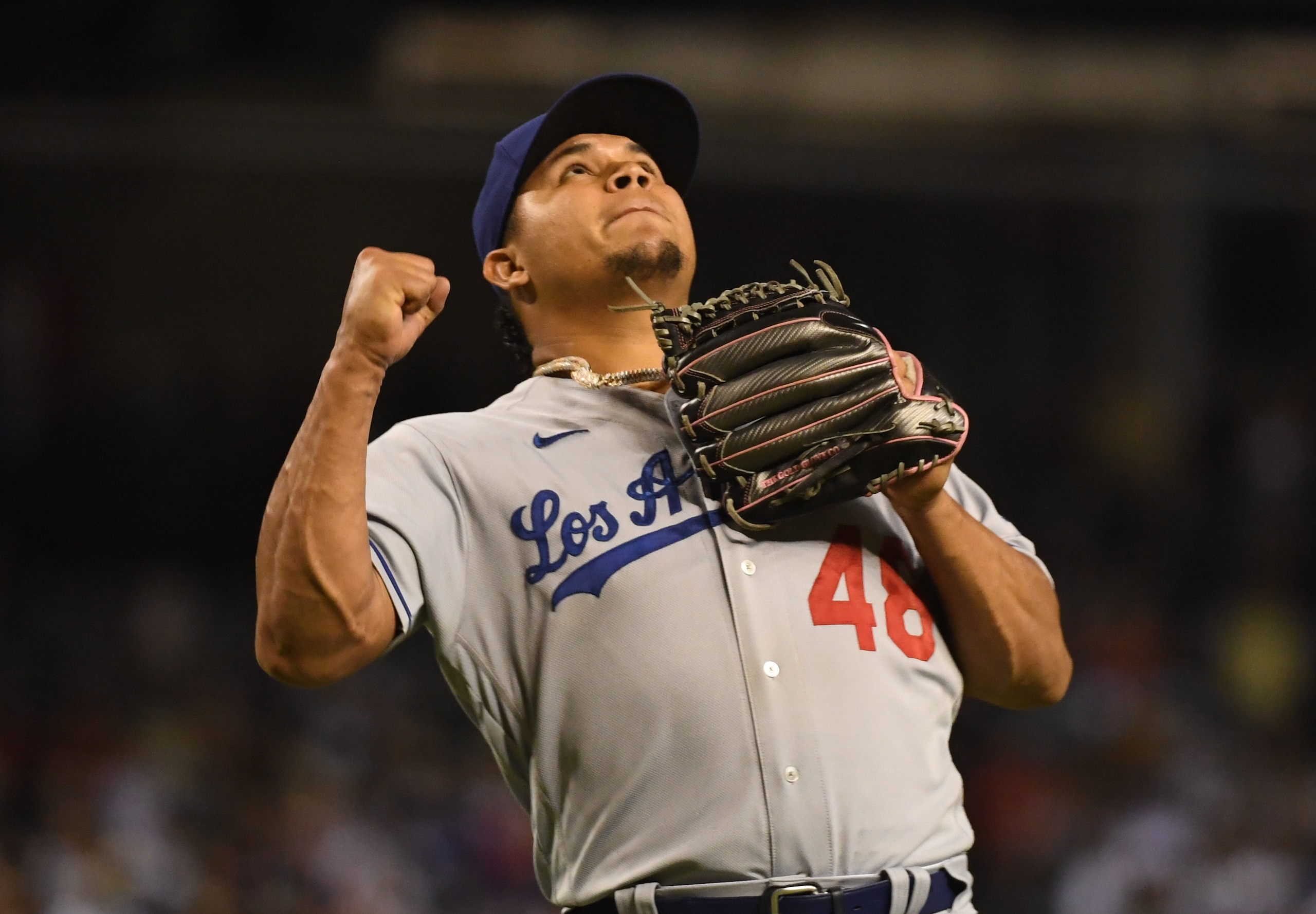 PHOENIX, ARIZONA - SEPTEMBER 25: Brusdar Graterol #48 of the Los Angeles Dodgers reacts after starting a double play on a ground ball hit by Christian Walker #53 of the Arizona Diamondbacks during the fifth inning at Chase Field on September 25, 2021 in Phoenix, Arizona. (Photo by Norm Hall/Getty Images)
