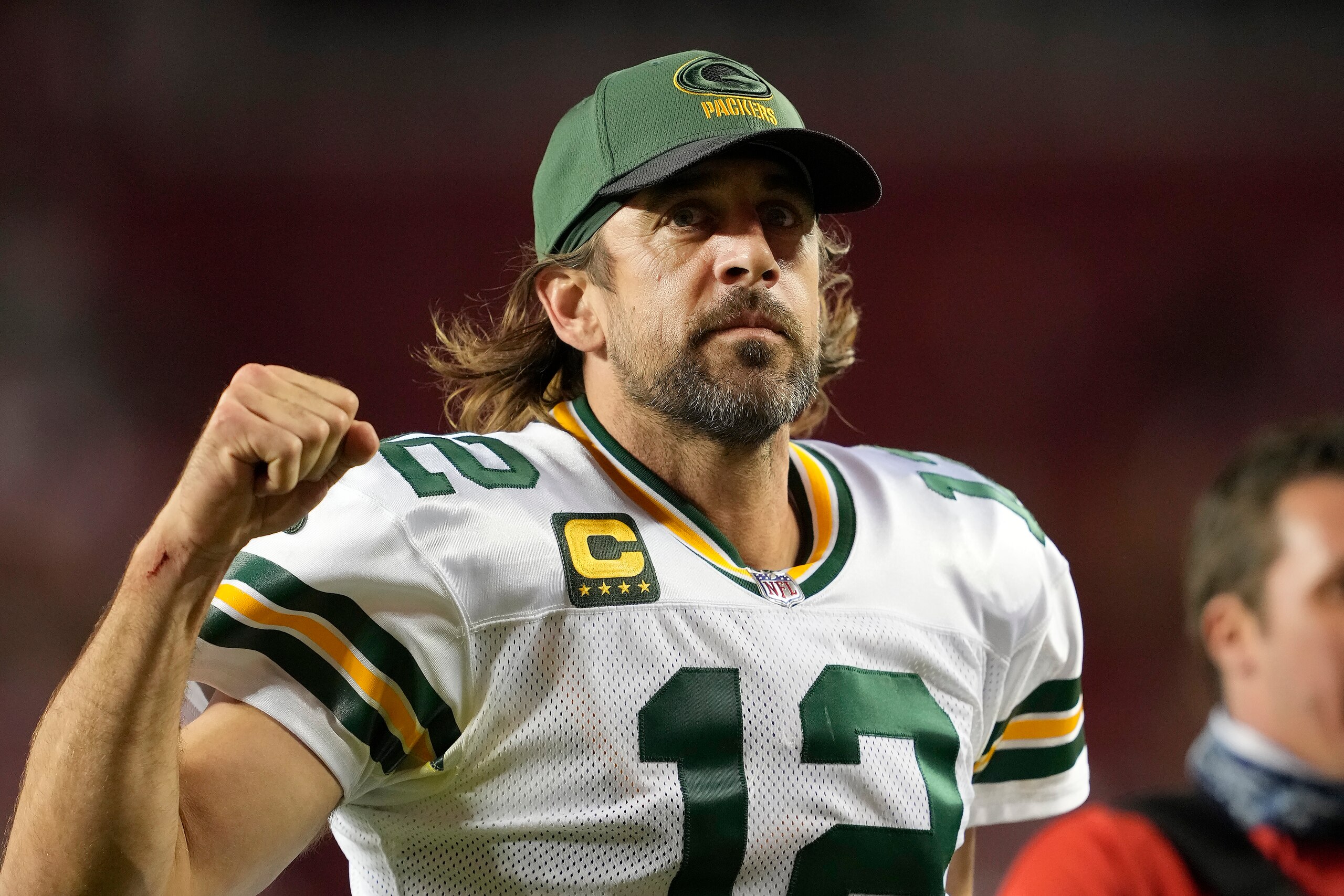Green Bay Packers quarterback Aaron Rodgers (12) gestures as he jogs off the field after the Packers defeated the San Francisco 49ers in an NFL football game in Santa Clara, Calif., Sunday, Sept. 26, 2021. (AP Photo/Tony Avelar)