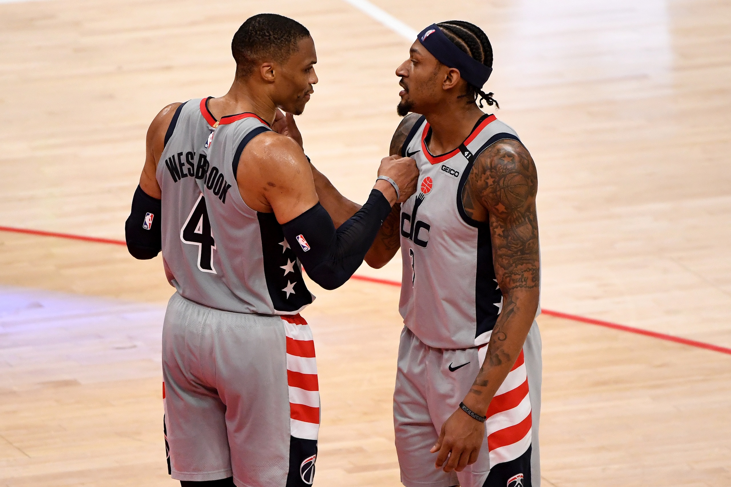 WASHINGTON, DC - MAY 16: Russell Westbrook #4 and Bradley Beal #3 of the Washington Wizards celebrate after defeating the Charlotte Hornets at Capital One Arena on May 16, 2021 in Washington, DC. NOTE TO USER: User expressly acknowledges and agrees that, by downloading and or using this photograph, User is consenting to the terms and conditions of the Getty Images License Agreement. (Photo by Will Newton/Getty Images)
