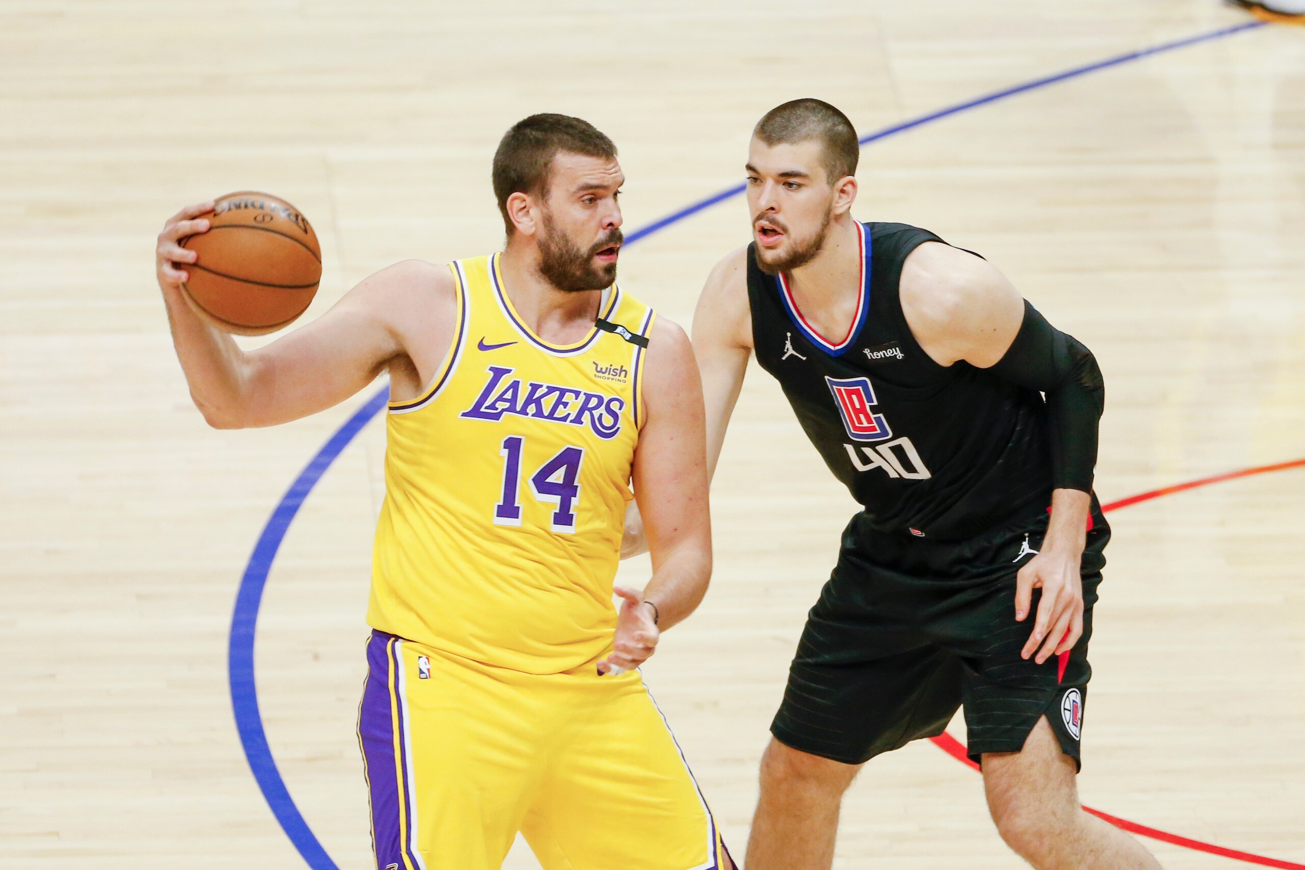Los Angeles Lakers' Marc Gasol (14) is defended by Los Angeles Clippers' Ivica Zubac (40) during an NBA basketball game between the Los Angeles Lakers and the Los Angeles Clippers, Thursday, May 6, 2021, in Los Angeles. (AP Photo/Ringo H.W. Chiu) Los Angeles Lakers' Marc Gasol (14) is defended by Los Angeles Clippers' Ivica Zubac (40) during an NBA basketball game between the Los Angeles Lakers and the Los Angeles Clippers, Thursday, May 6, 2021, in Los Angeles. (AP Photo/Ringo H.W. Chiu)