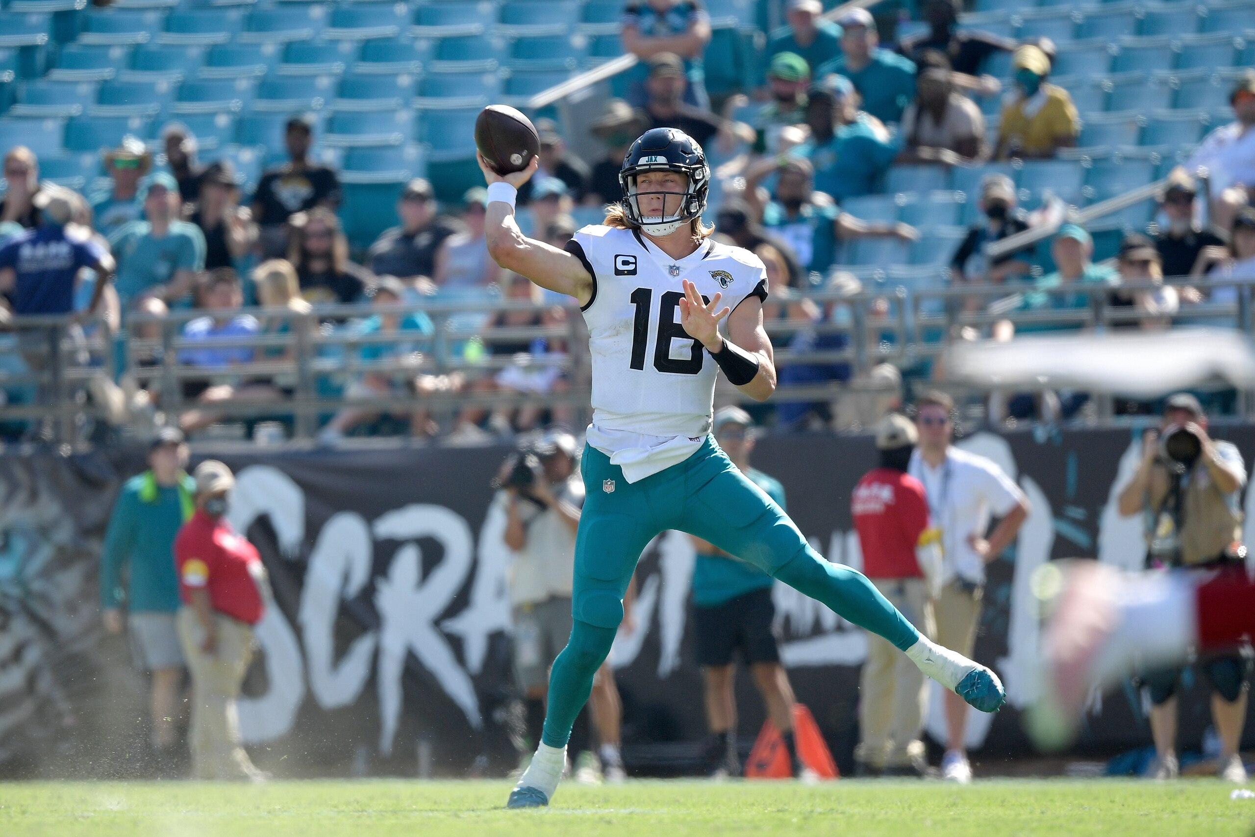 Jacksonville Jaguars quarterback Trevor Lawrence (16) throws a pass during the second half of an NFL football game against the Arizona Cardinals, Sunday, Sept. 26, 2021, in Jacksonville, Fla. (AP Photo/Phelan M. Ebenhack)