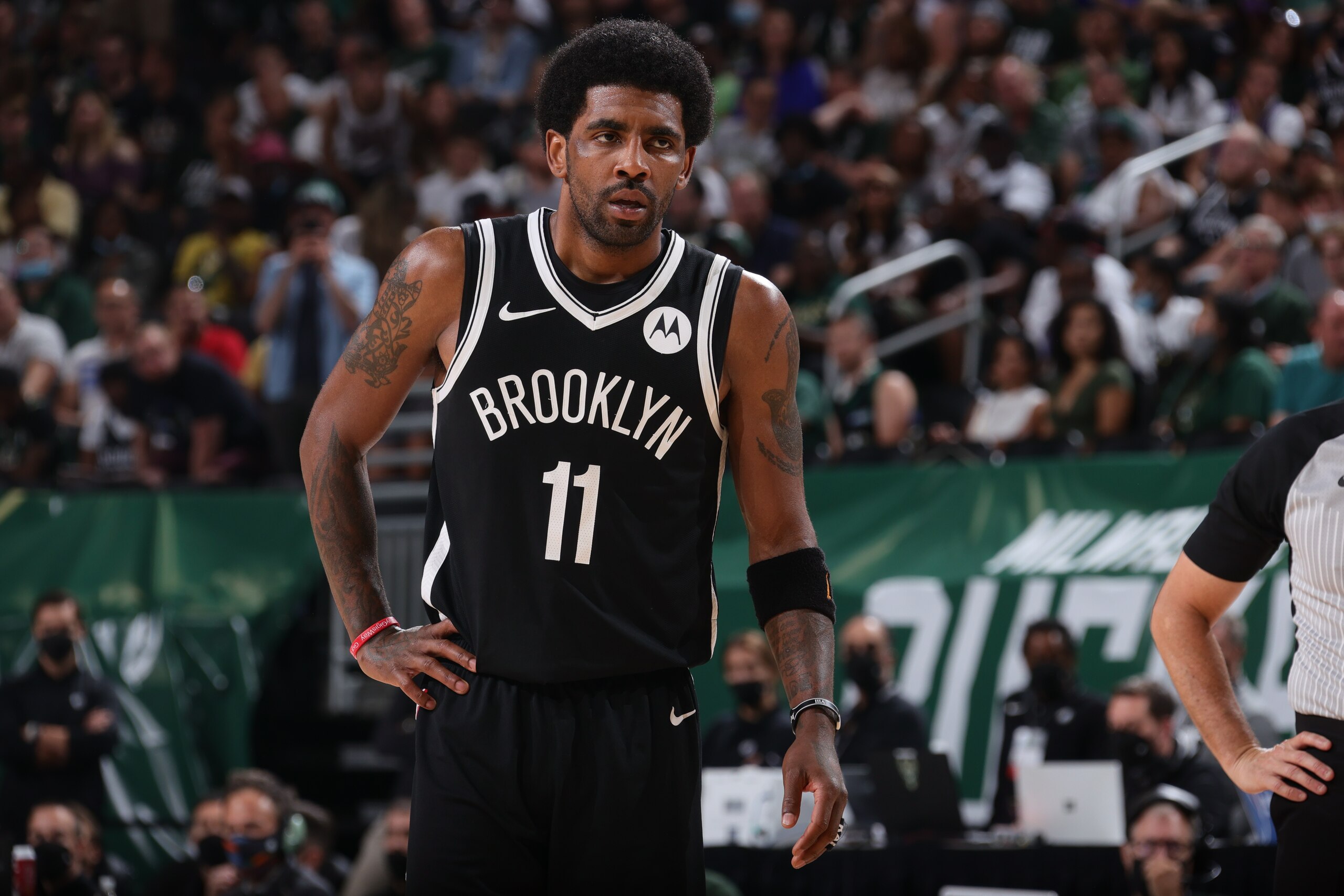 MILWAUKEE, WI - JUNE 13: Kyrie Irving #11 of the Brooklyn Nets looks on during Round 2, Game 4 of the 2021 NBA Playoffs on June 13 2021 at the Fiserv Forum Center in Milwaukee, Wisconsin. NOTE TO USER: User expressly acknowledges and agrees that, by downloading and or using this Photograph, user is consenting to the terms and conditions of the Getty Images License Agreement. Mandatory Copyright Notice: Copyright 2021 NBAE (Photo by Nathaniel S. Butler/NBAE via Getty Images).