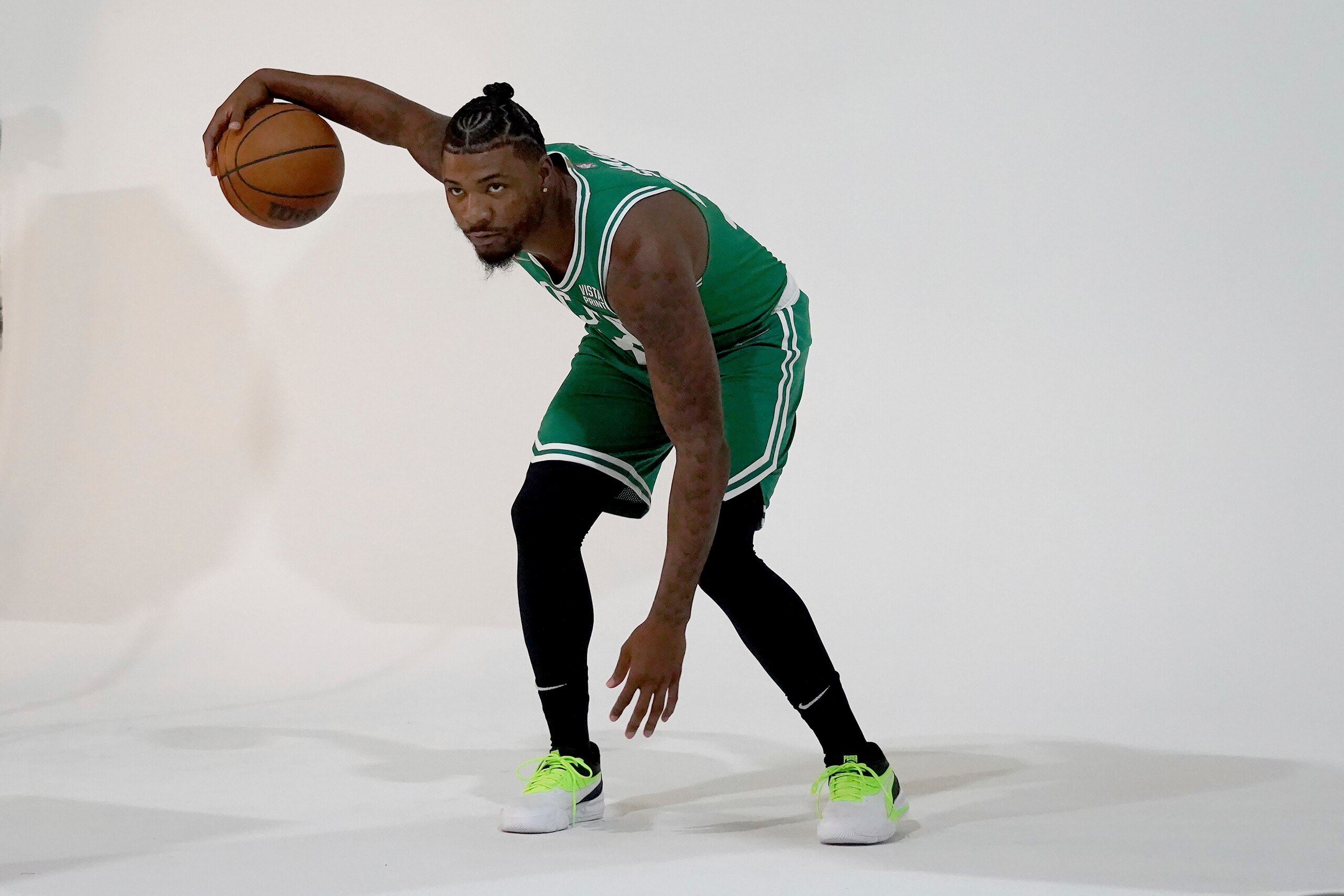 Boston Celtics guard Marcus Smart dribbles the ball for a photo shoot during the Boston Celtics Media Day, Monday, Sept. 27, 2021, in Canton, Mass. (AP Photo/Mary Schwalm)