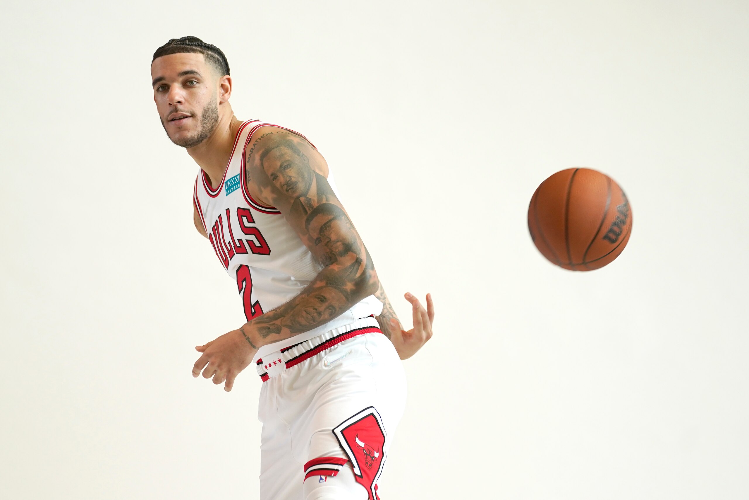 Chicago Bulls' Lonzo Ball makes a behind-the-back pass for photographers during the Bulls' NBA basketball media day Monday, Sept. 27, 2021, in Chicago. (AP Photo/Charles Rex Arbogast) Chicago Bulls' Lonzo Ball makes a behind-the-back pass for photographers during the Bulls' NBA basketball media day Monday, Sept. 27, 2021, in Chicago. (AP Photo/Charles Rex Arbogast)