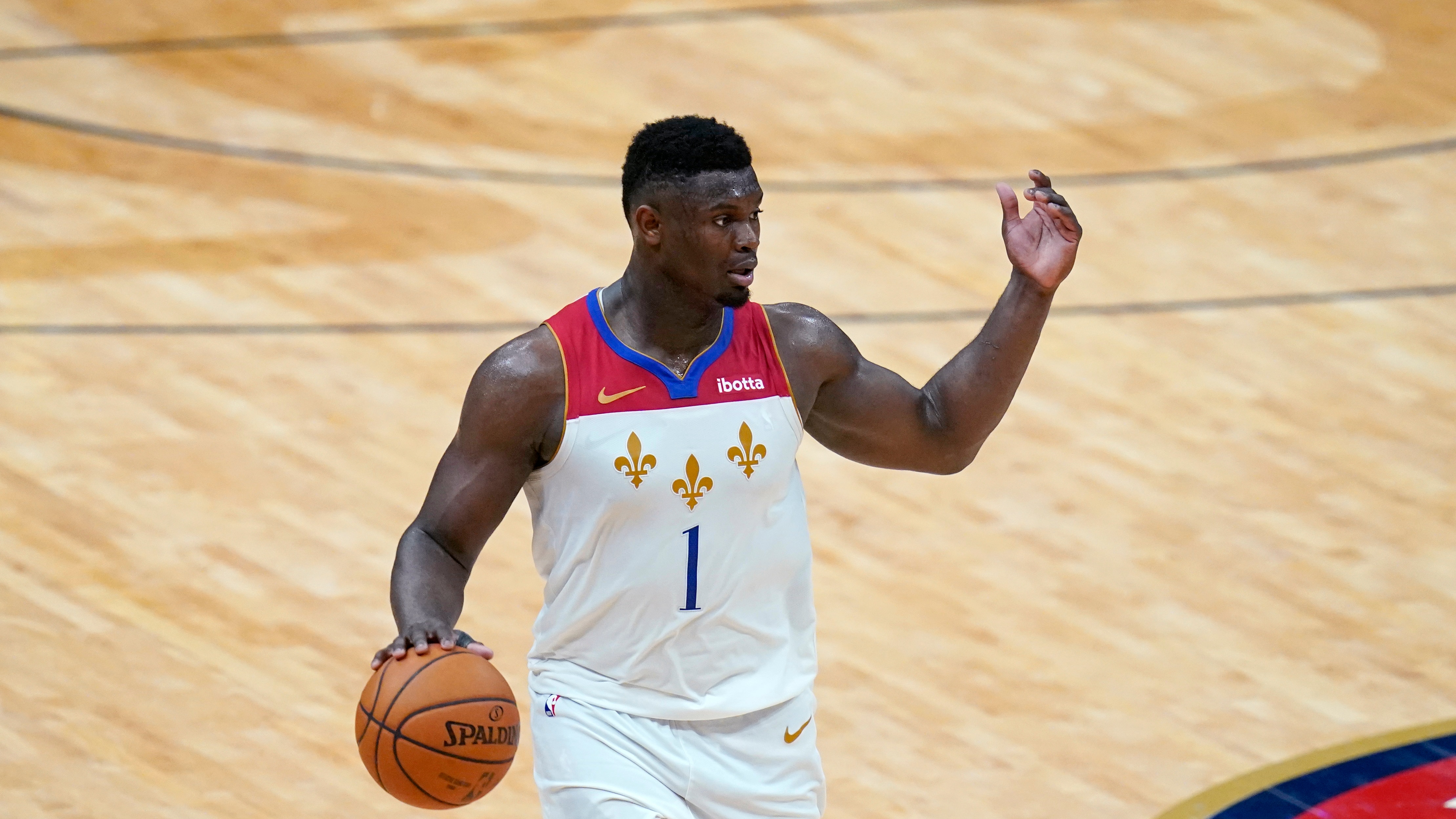 New Orleans Pelicans forward Zion Williamson (1) moves the ball up court in the second half of an NBA basketball game against the Golden State Warriors in New Orleans, Tuesday, May 4, 2021. (AP Photo/Gerald Herbert)
