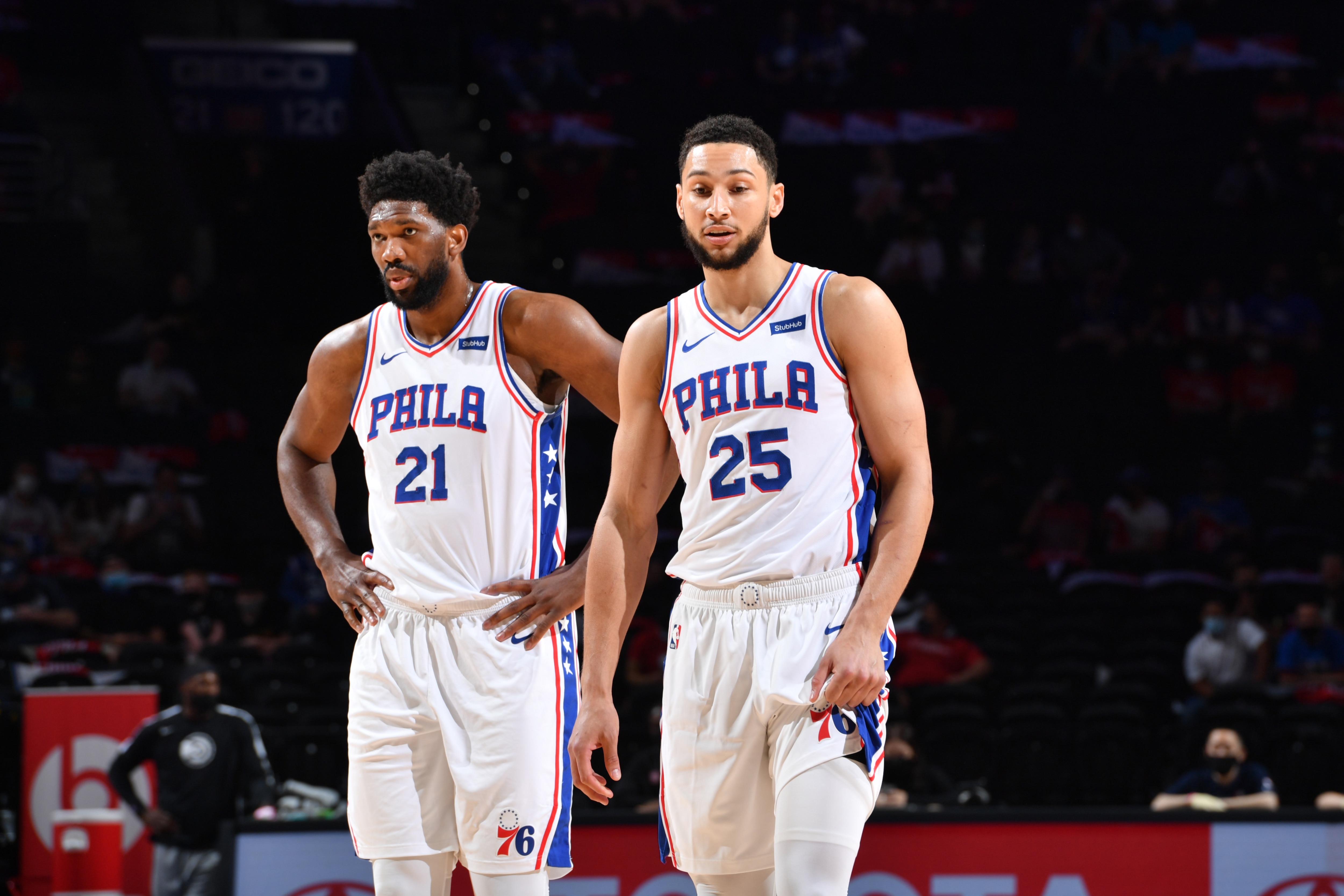 PHILADELPHIA, PA - APRIL 28: Joel Embiid #21 of the Philadelphia 76ers and Ben Simmons #25 of the Philadelphia 76ers look on during a game on April 28, 2021 at Wells Fargo Center in Philadelphia, Pennsylvania. NOTE TO USER: User expressly acknowledges and agrees that, by downloading and/or using this Photograph, user is consenting to the terms and conditions of the Getty Images License Agreement. Mandatory Copyright Notice: Copyright 2021 NBAE (Photo by Jesse D. Garrabrant/NBAE via Getty Images)
