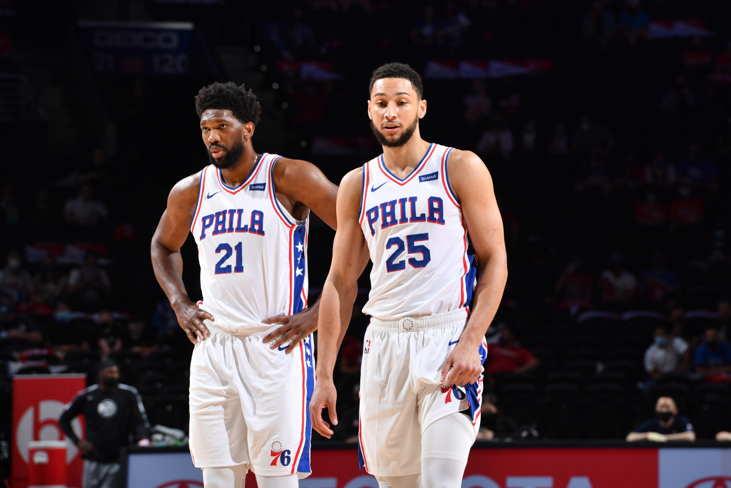 PHILADELPHIA, PA - APRIL 28: Joel Embiid #21 of the Philadelphia 76ers and Ben Simmons #25 of the Philadelphia 76ers look on during a game on April 28, 2021 at Wells Fargo Center in Philadelphia, Pennsylvania. NOTE TO USER: User expressly acknowledges and agrees that, by downloading and/or using this Photograph, user is consenting to the terms and conditions of the Getty Images License Agreement. Mandatory Copyright Notice: Copyright 2021 NBAE (Photo by Jesse D. Garrabrant/NBAE via Getty Images)