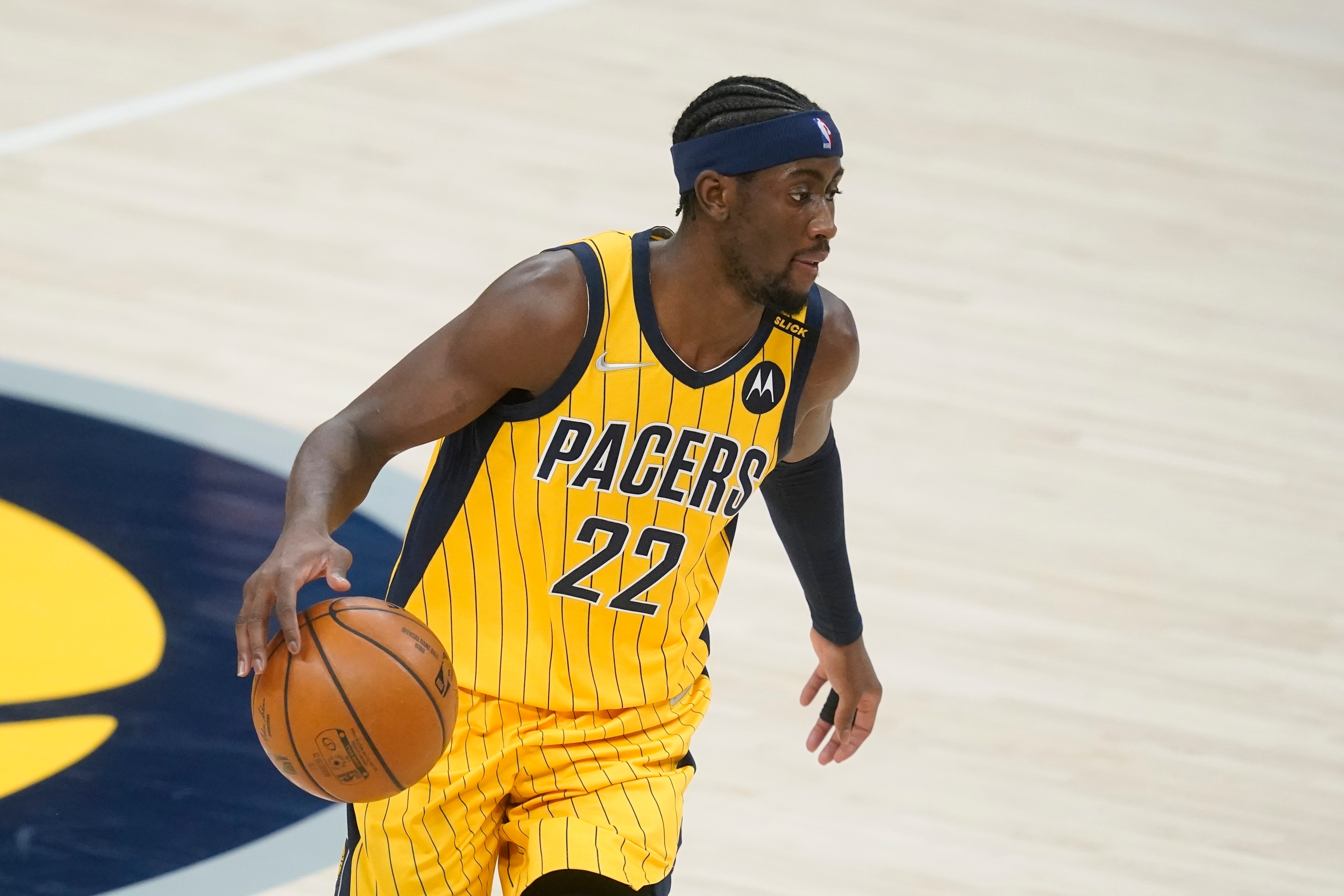 Indiana Pacers' Caris LeVert (22) dribbles during the second half of an NBA basketball game against the Washington Wizards, Saturday, May 8, 2021, in Indianapolis. (AP Photo/Darron Cummings)