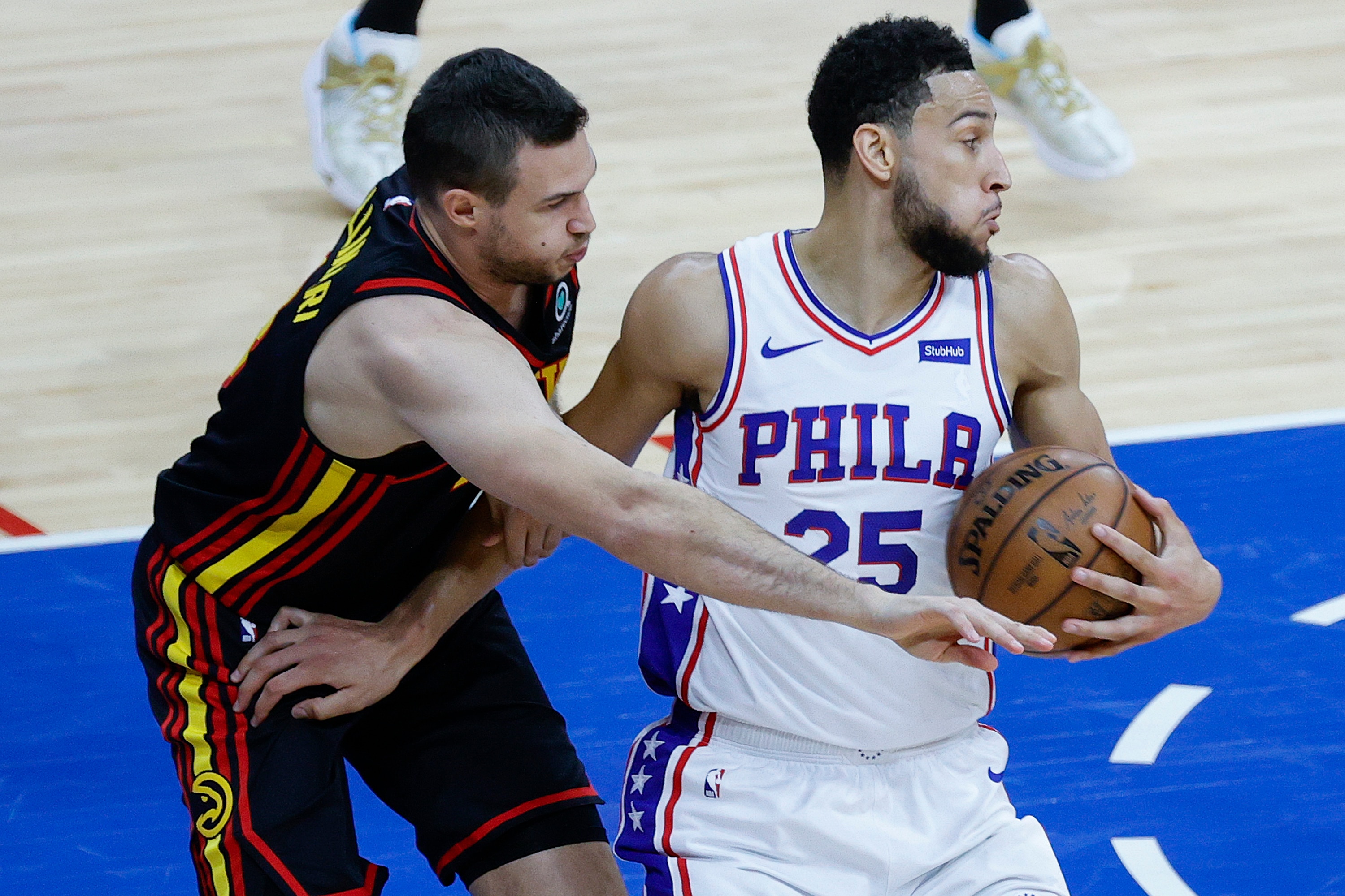 PHILADELPHIA, PENNSYLVANIA - JUNE 20: Danilo Gallinari #8 of the Atlanta Hawks tries to stela the ball from Ben Simmons #25 of the Philadelphia 76ers during the first quarter during Game Seven of the Eastern Conference Semifinals at Wells Fargo Center on June 20, 2021 in Philadelphia, Pennsylvania. NOTE TO USER: User expressly acknowledges and agrees that, by downloading and or using this photograph, User is consenting to the terms and conditions of the Getty Images License Agreement. (Photo by Tim Nwachukwu/Getty Images)