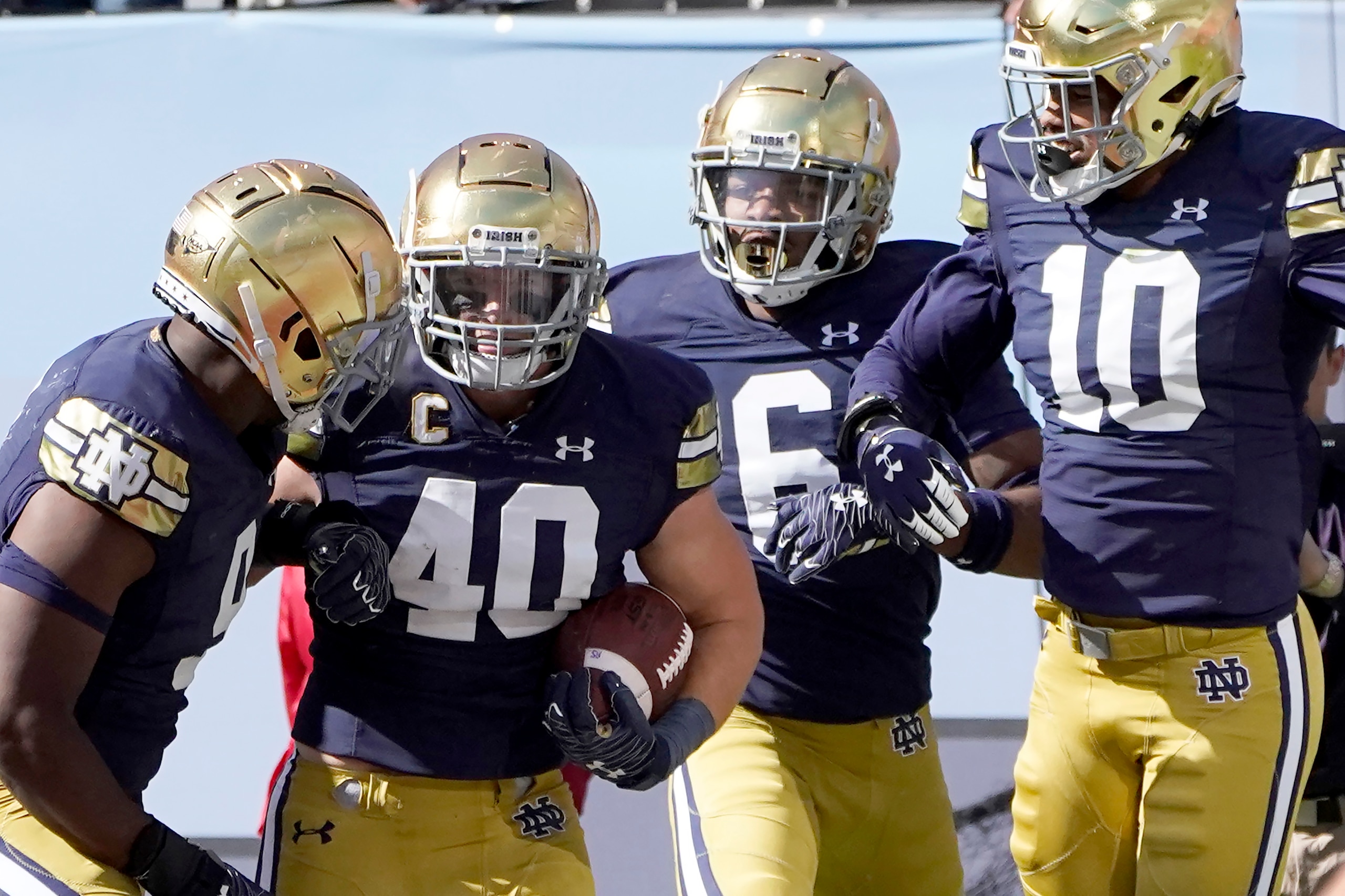 Notre Dame linebacker Drew White (40) celebrates his touchdown with teammate during the second half of an NCAA college football game against Wisconsin Saturday, Sept. 25, 2021, in Chicago. (AP Photo/Charles Rex Arbogast)