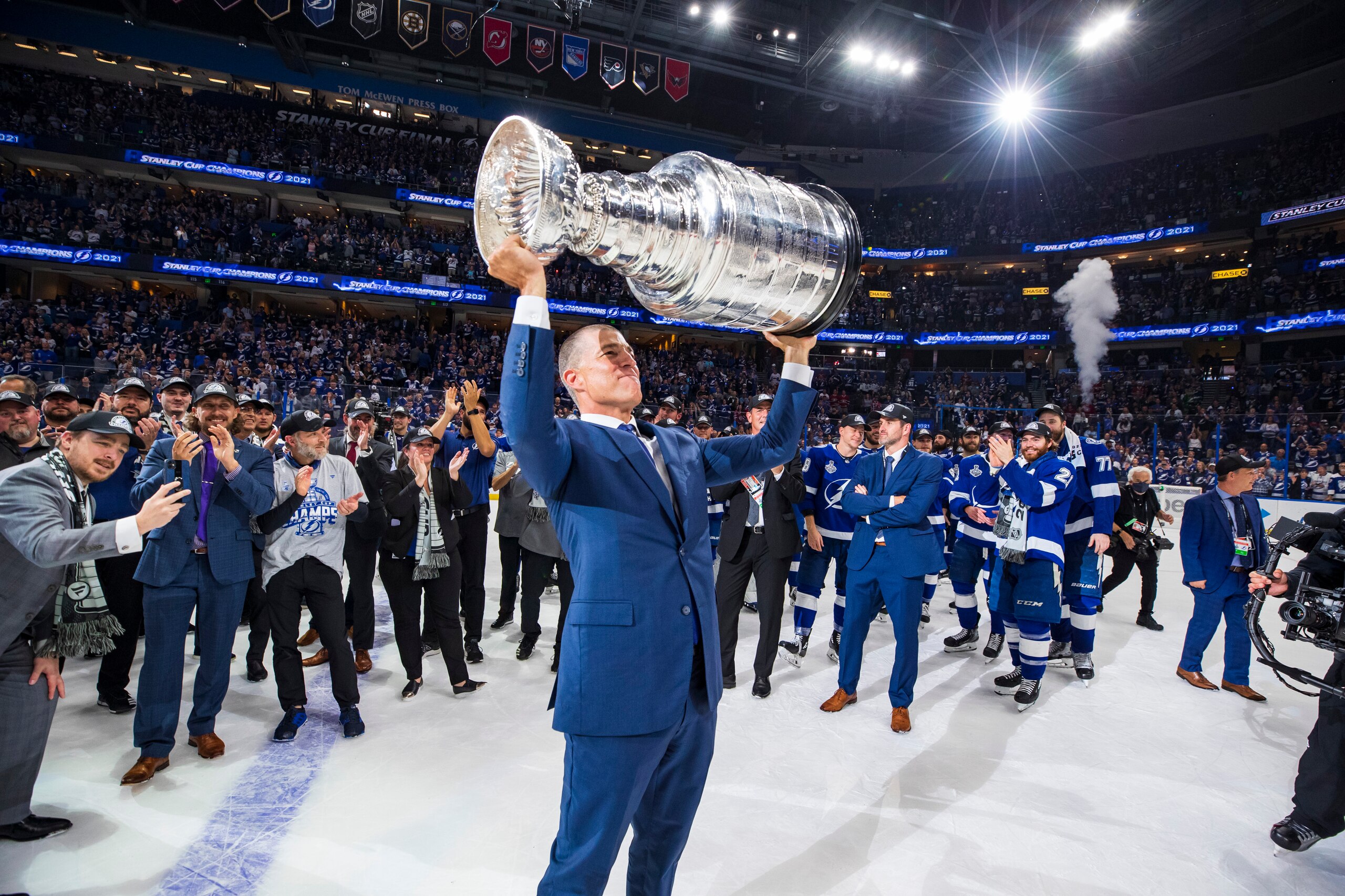 TAMPA, FL - JULY 7: Julien BriseBois, Vice President & General Manager, Alternate Governor of the Tampa Bay Lightning hoists the Stanley Cup overhead after the Tampa Bay Lightning defeated the Montreal Canadiens in Game Five to win the best of seven game series 4-1 during the Stanley Cup Final of the 2021 Stanley Cup Playoffs at Amalie Arena on July 7, 2021 in Tampa, Florida. (Photo by Scott Audette/NHLI via Getty Images)