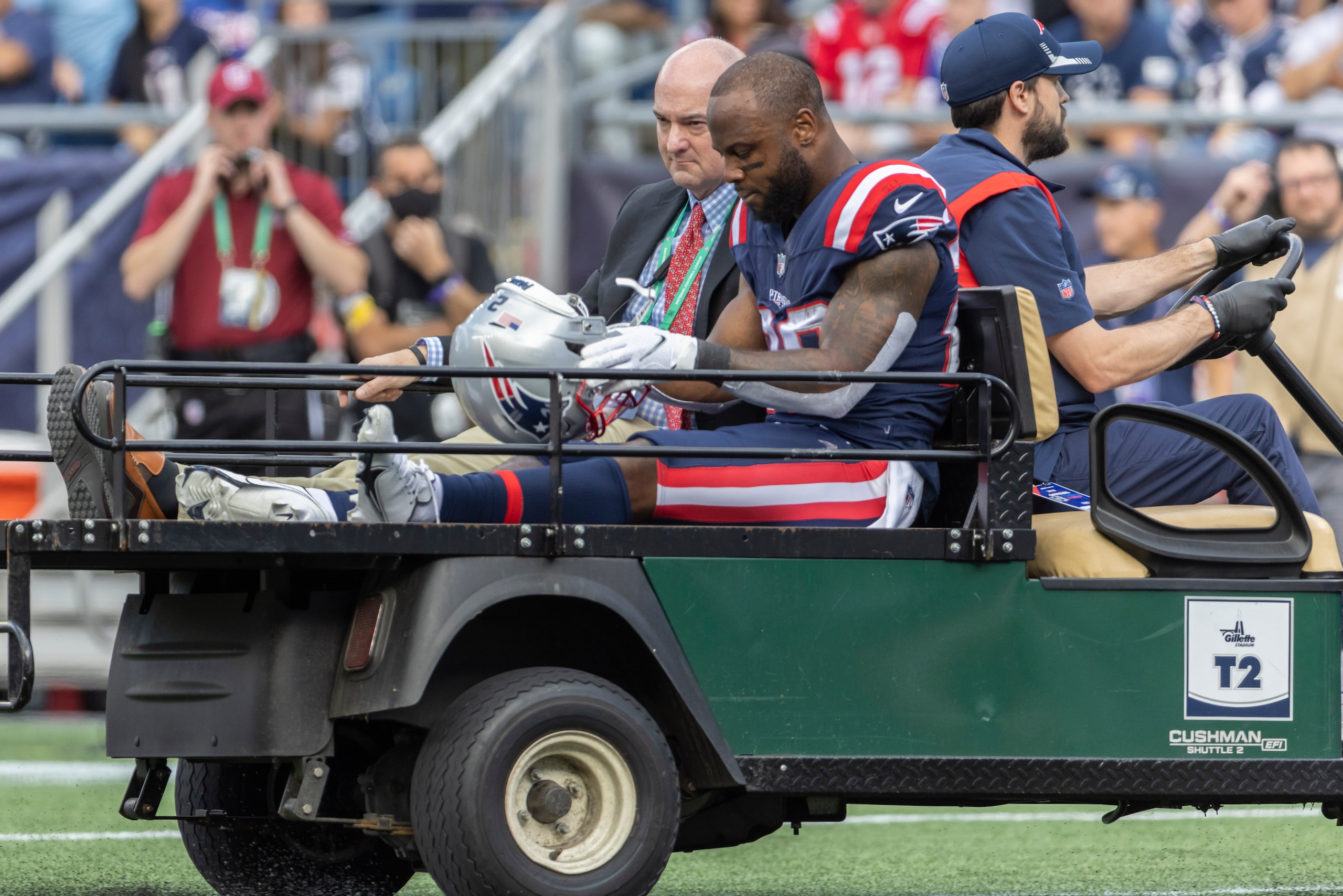 New England Patriots running back James White (28) is taken off the field against the New Orleans Saints during the first half of an NFL football game, Sunday, Sept. 26, 2021, in Foxborough, Mass. (AP Photo/Greg M. Cooper) New England Patriots running back James White (28) is taken off the field against the New Orleans Saints during the first half of an NFL football game, Sunday, Sept. 26, 2021, in Foxborough, Mass. (AP Photo/Greg M. Cooper)