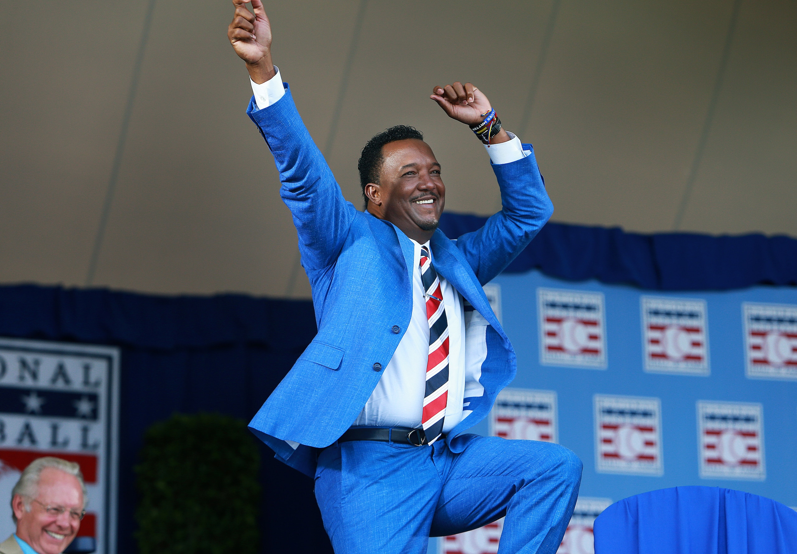 COOPERSTOWN - JULY 26: A jubilant Pedro Martinez does a dance as he comes to the podium for his speech. Former Boston Red Sox star pitcher Pedro Martinez was inducted into the National Baseball Hall of Fame in Cooperstown, NY on Jul. 26, 2015. (Photo by Jim Davis/The Boston Globe via Getty Images)