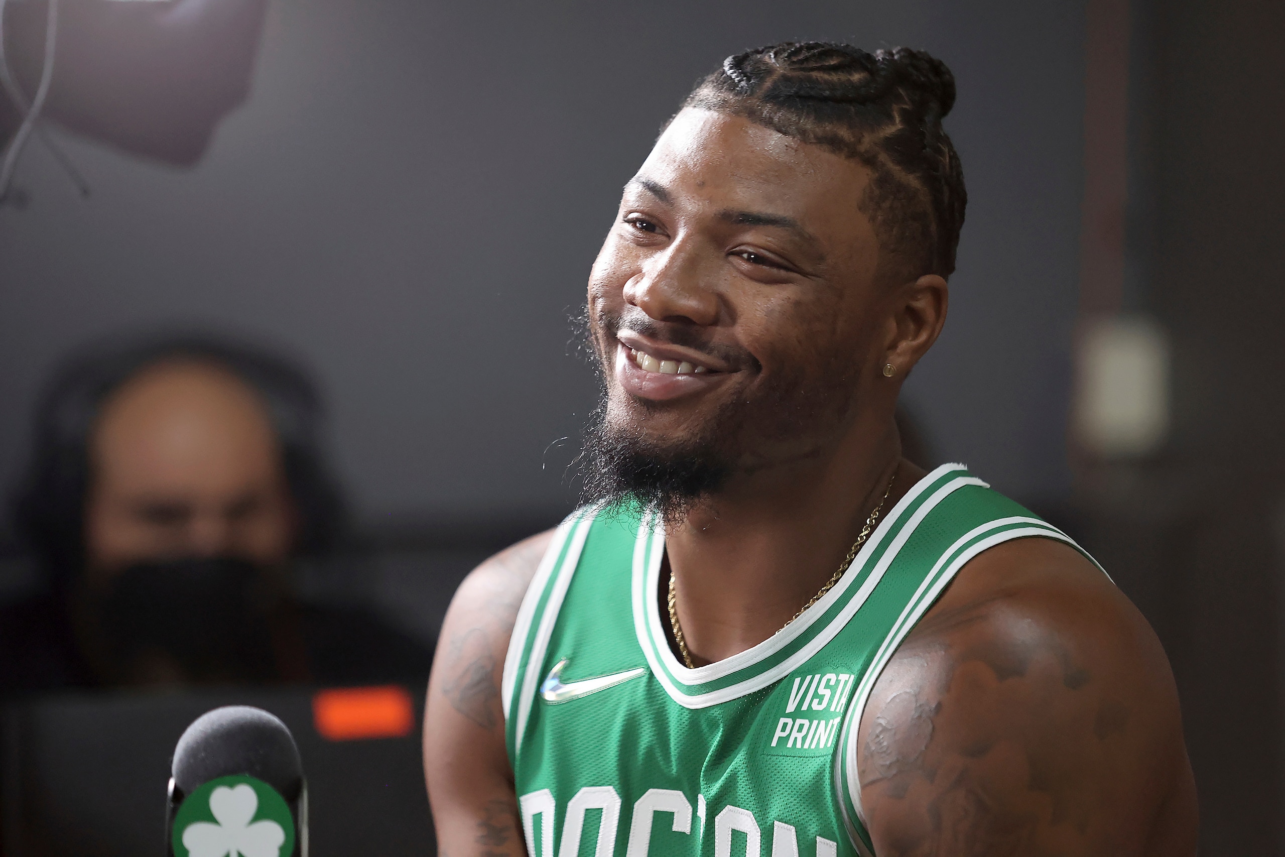 Boston Celtics guard Marcus Smart smiles during an interview at the Boston Celtics Media Day, Monday, Sept. 27, 2021, in Canton, Mass. (AP Photo/Mary Schwalm)