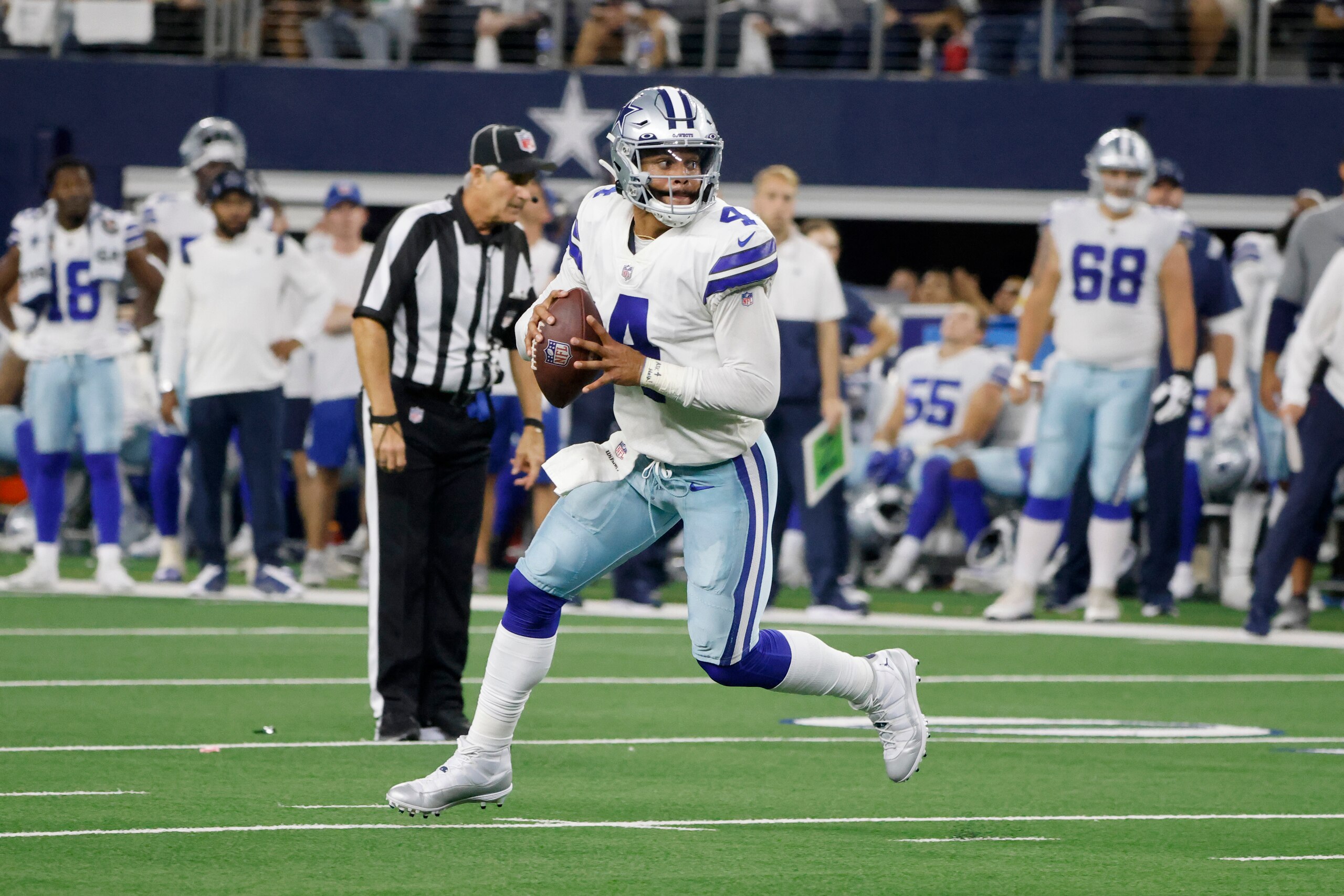 Dallas Cowboys quarterback Dak Prescott (4) looks to pass against the Philadelphia Eagles during an NFL football game in Arlington, Texas, Monday, Sept. 27, 2021. (AP Photo/Michael Ainsworth)