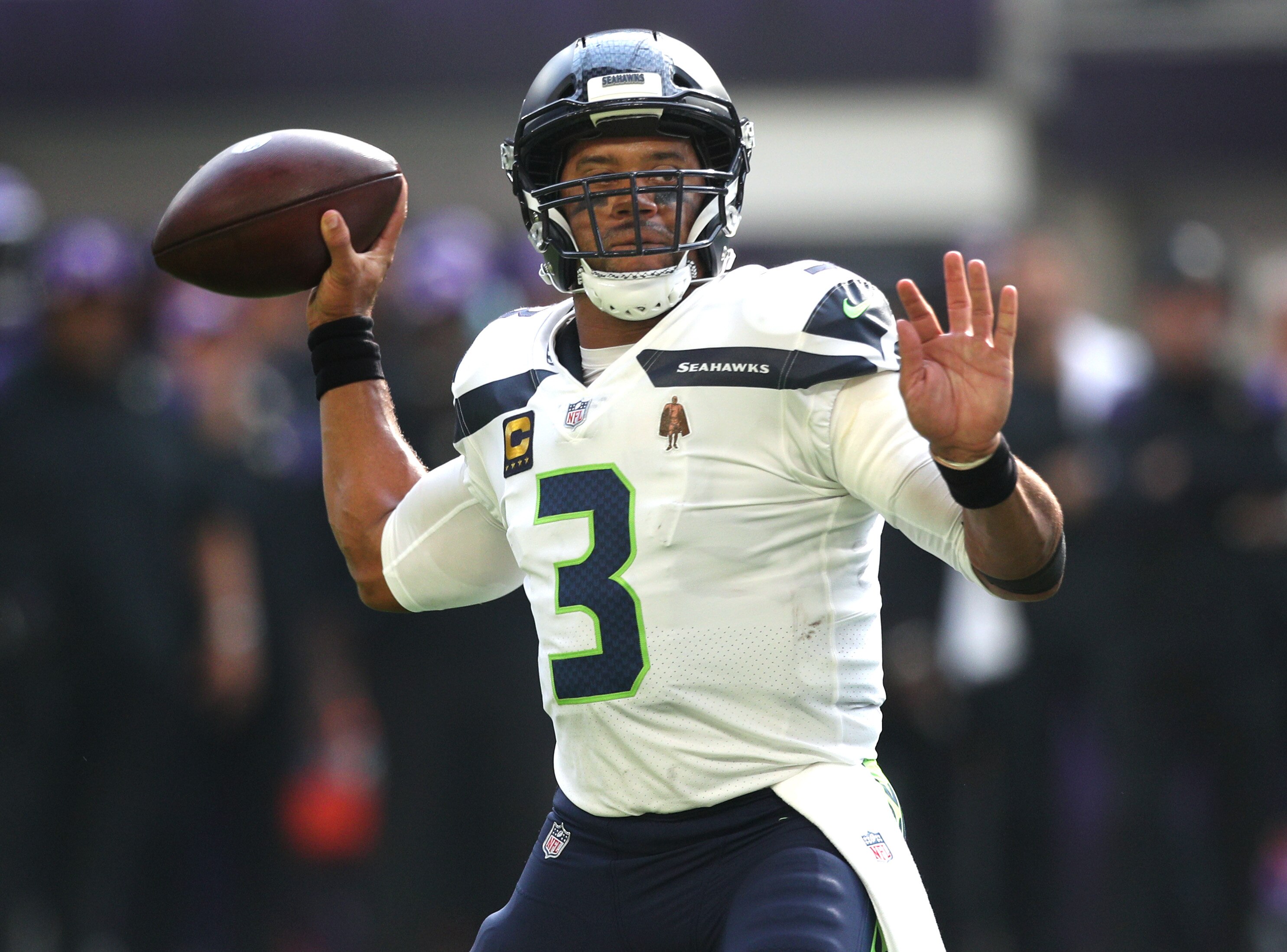 MINNEAPOLIS, MINNESOTA - SEPTEMBER 26: Russell Wilson #3 of the Seattle Seahawks throws the ball to DK Metcalf #14 (not pictured) for a touchdown in the first quarter in the game against the Minnesota Vikings at U.S. Bank Stadium on September 26, 2021 in Minneapolis, Minnesota. (Photo by David Berding/Getty Images)