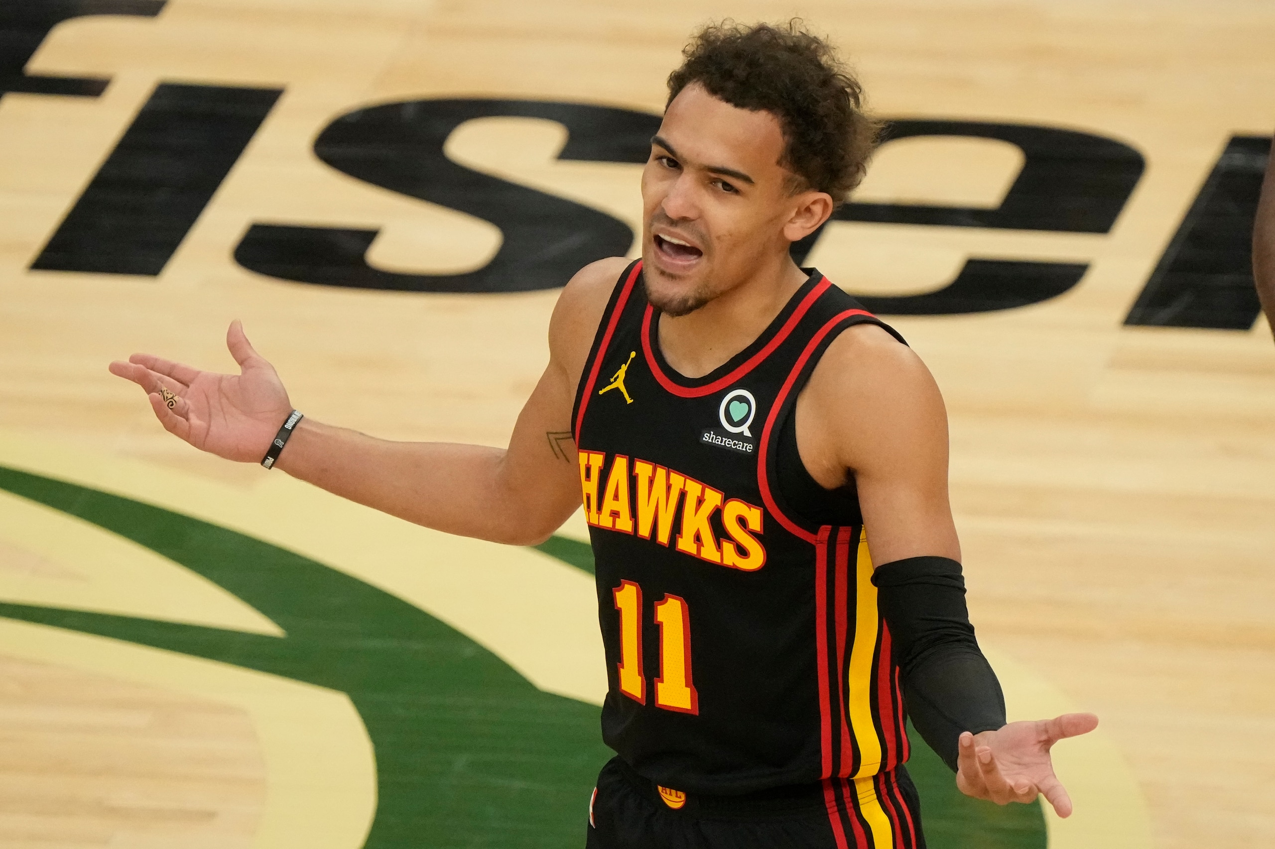 Atlanta Hawks' Trae Young reacts to a call during the first half of Game 2 of the NBA Eastern Conference basketball finals game against the Milwaukee Bucks Friday, June 25, 2021, in Milwaukee. (AP Photo/Morry Gash)