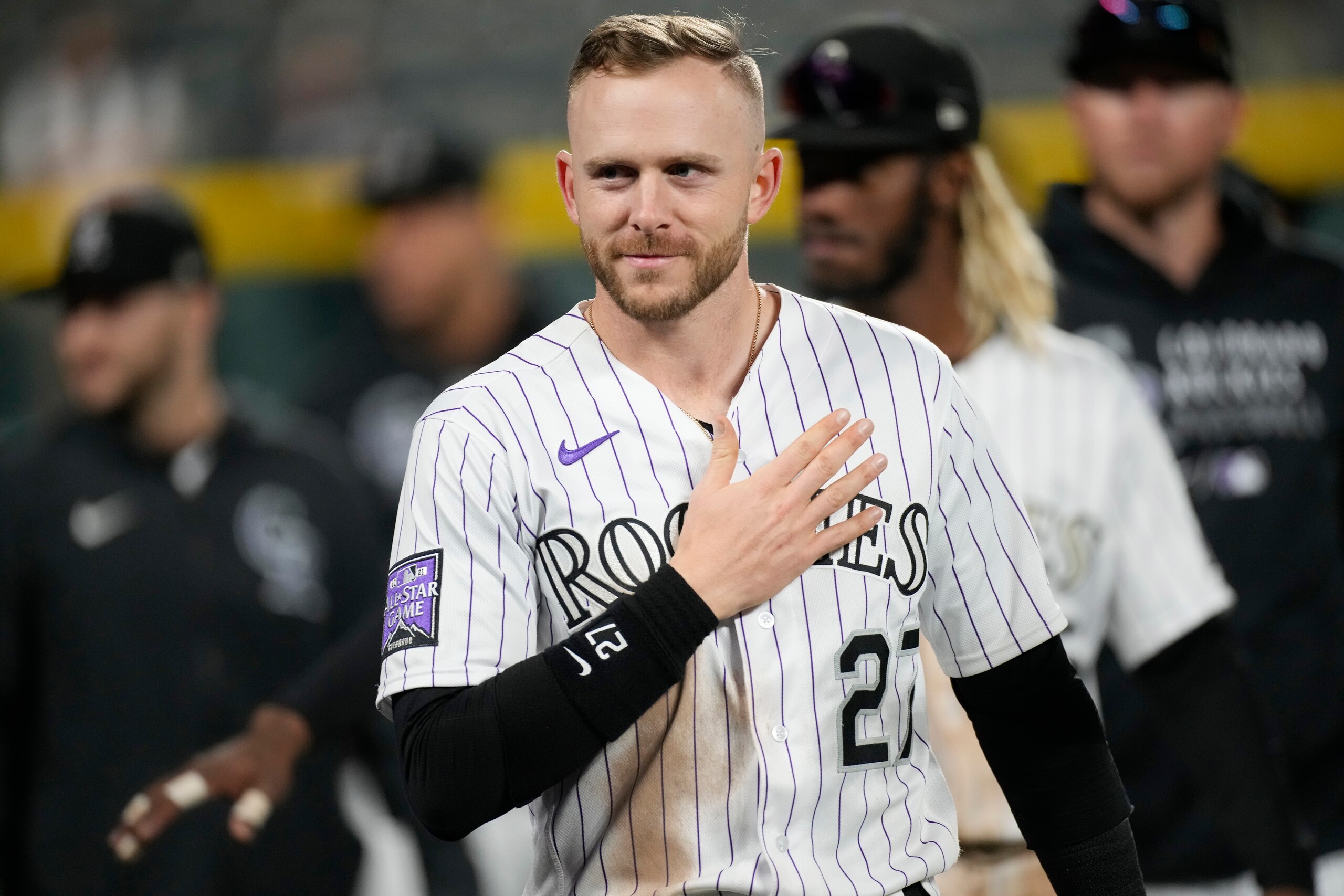 Colorado Rockies shortstop Trevor Story gestures to fans during a ceremonial walk around the park after a baseball game Wednesday, Sept. 29, 2021, in Denver. The Rockies posted a 10-5 victory over the Washington Nationals. (AP Photo/David Zalubowski)