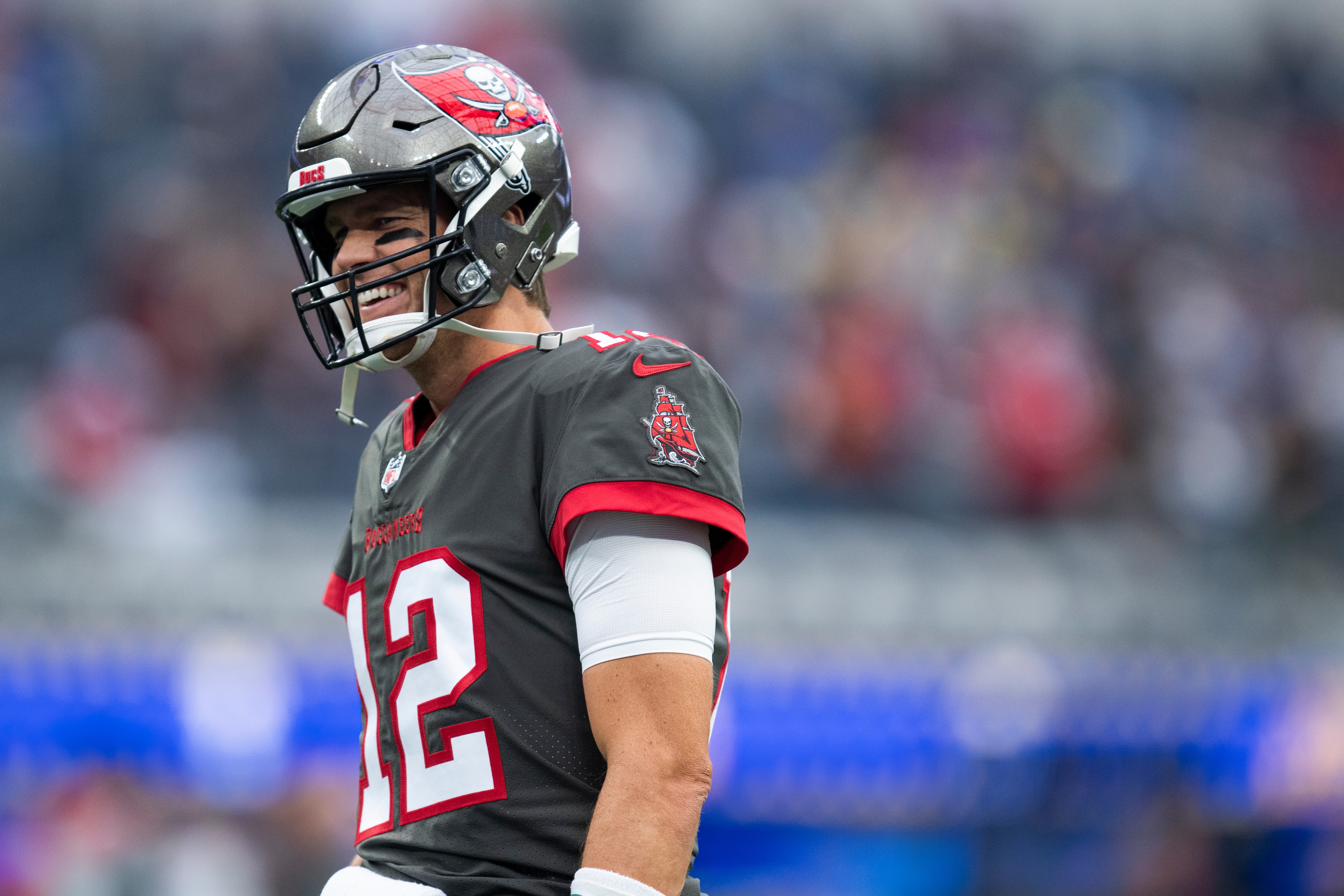 Tampa Bay Buccaneers quarterback Tom Brady (12) smiles before an NFL football game against the Los Angeles Rams Sunday, Sept. 26, 2021, in Inglewood, Calif. (AP Photo/Kyusung Gong)