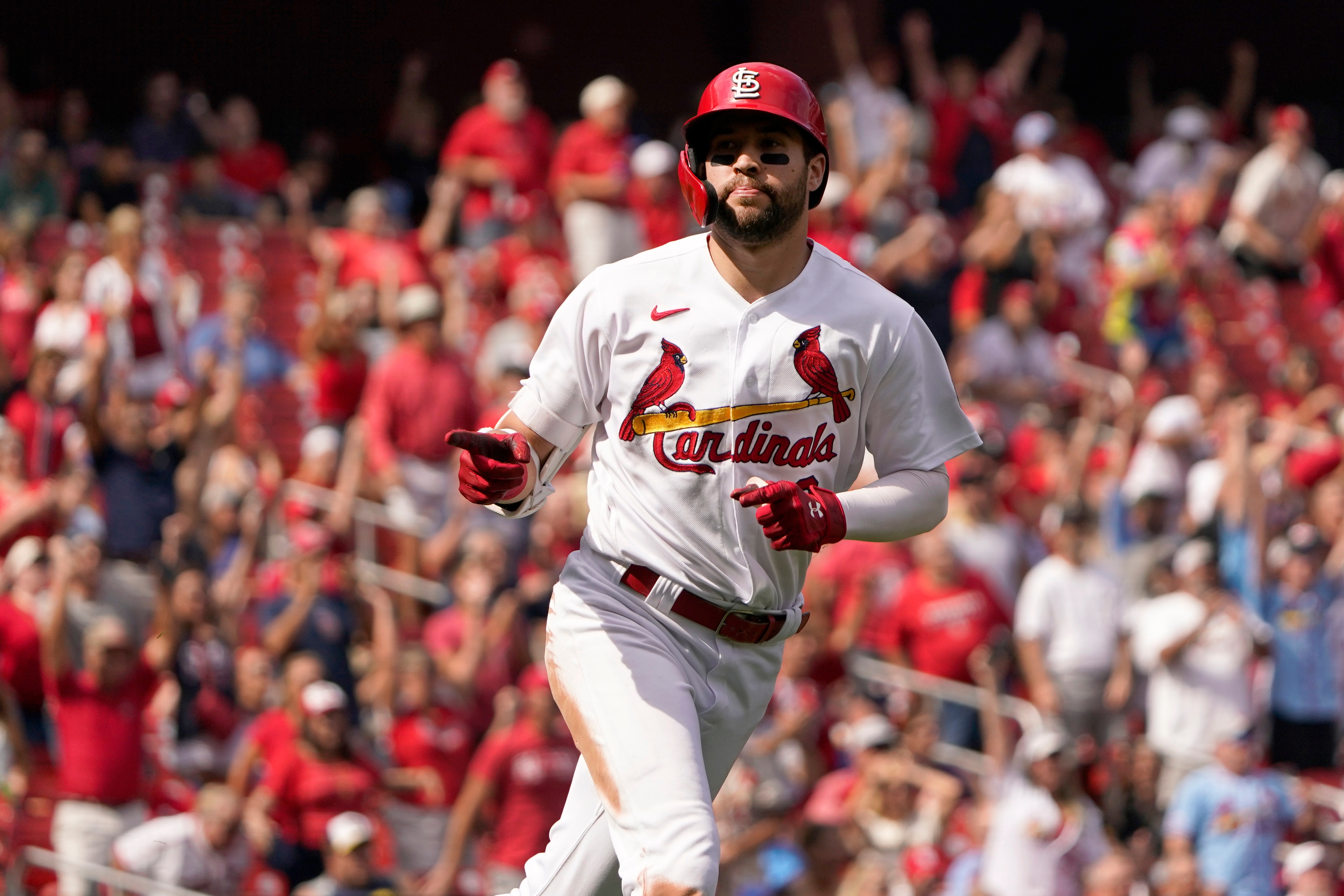 St. Louis Cardinals' Dylan Carlson celebrates as he rounds the bases after hitting a two-run home run during the sixth inning of a baseball game against the Milwaukee Brewers Thursday, Sept. 30, 2021, in St. Louis. Carlson also hit a solo home run during the third inning. (AP Photo/Jeff Roberson)