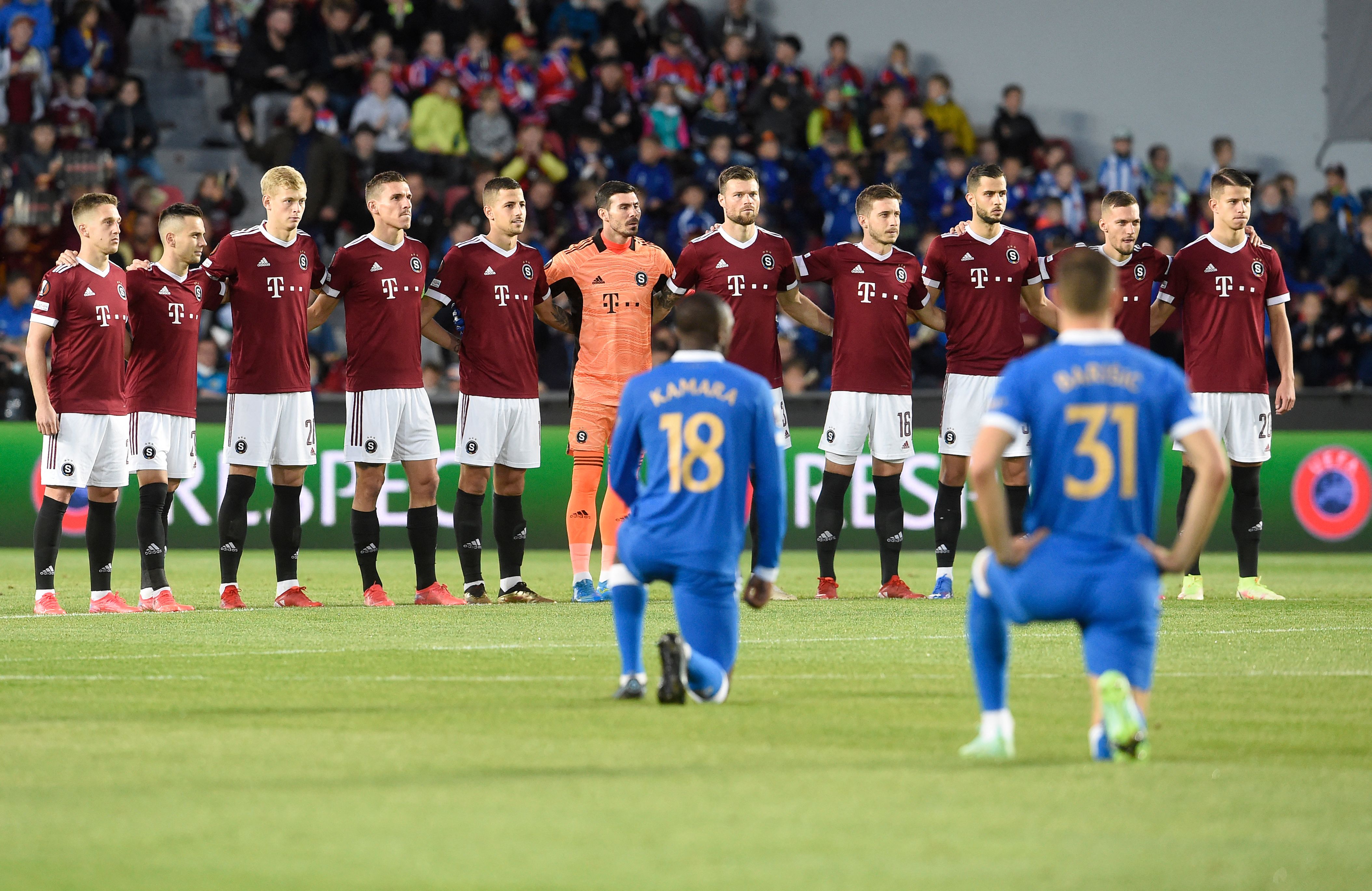 Sparta Prague's players stand while Rangers' Finnish midfielder Glen Kamara (front L) and Rangers' Croatian defender Borna Barisic take the knee prior to the start of the UEFA Europa League Group A football match between AC Sparta Praha and Rangers FC in Prague on September 30, 2021. (Photo by Michal CIZEK / AFP) (Photo by MICHAL CIZEK/AFP via Getty Images)