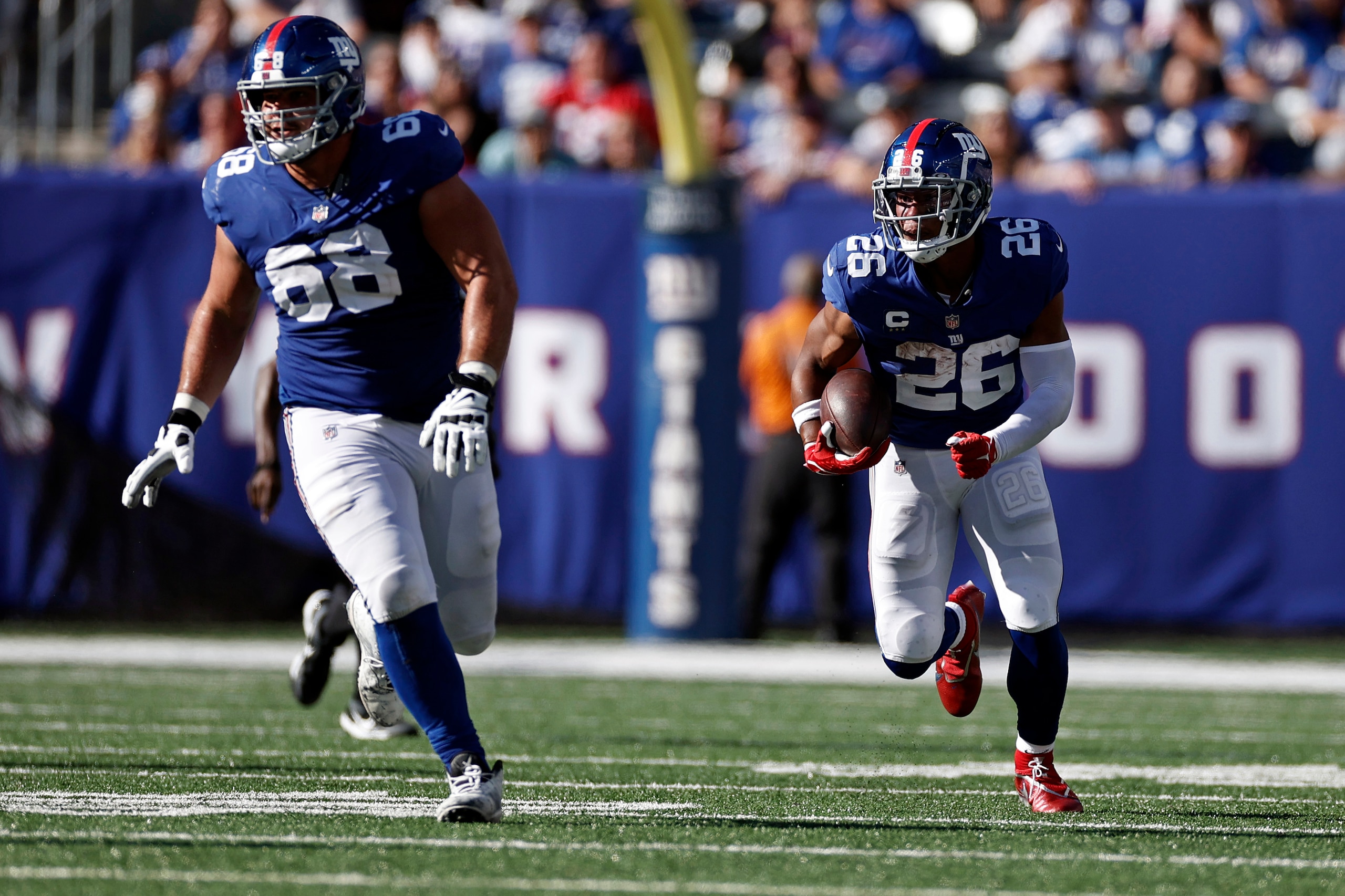 New York Giants running back Saquon Barkley (26) runs against the Atlanta Falcons during an NFL football game, Sunday, Sept. 26, 2021, in East Rutherford, N.J. (AP Photo/Adam Hunger)