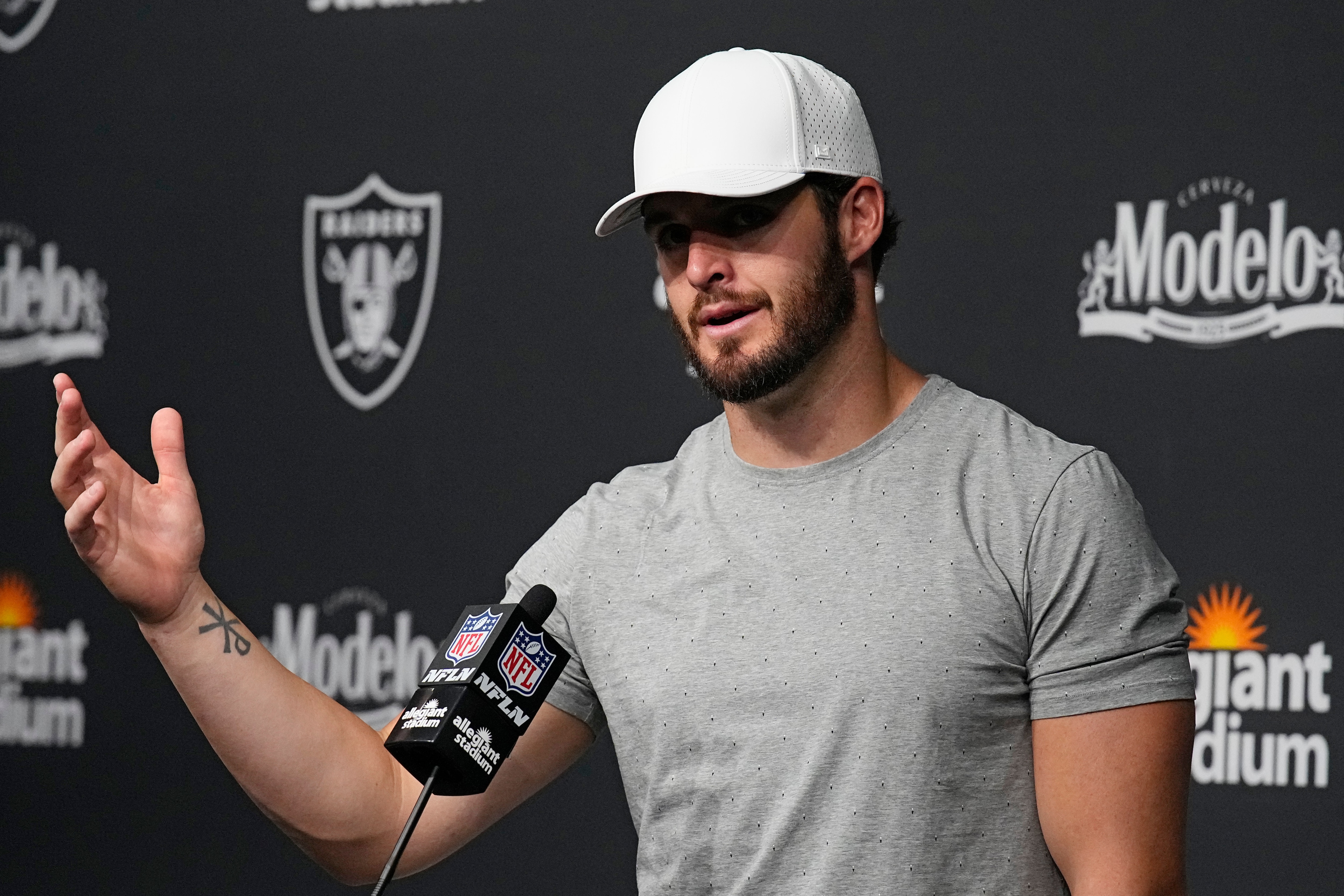 Las Vegas Raiders quarterback Derek Carr (4) attends a news conference after an NFL football game against the Miami Dolphins, Sunday, Sept. 26, 2021, in Las Vegas. (AP Photo/Rick Scuteri)