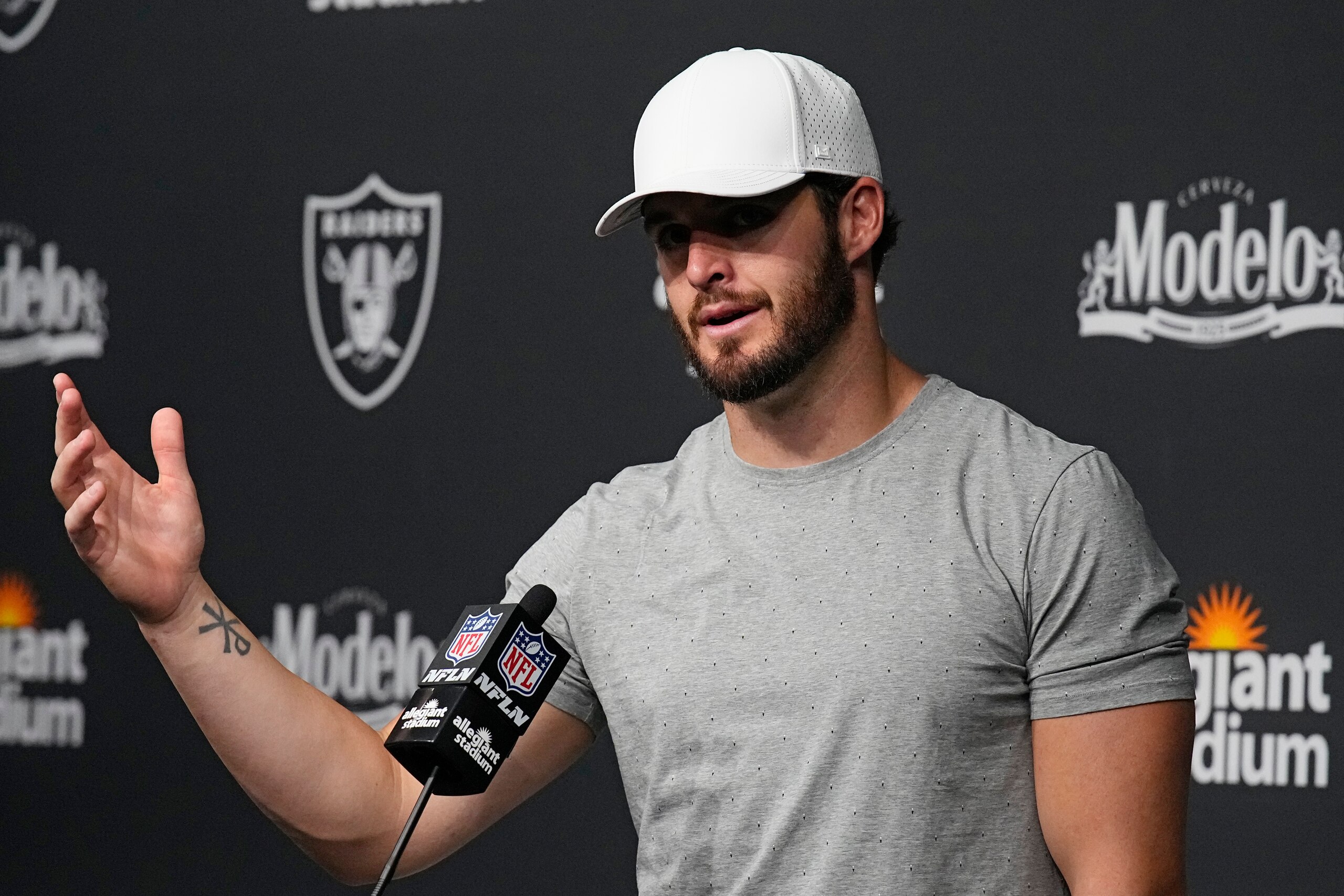 Las Vegas Raiders quarterback Derek Carr (4) attends a news conference after an NFL football game against the Miami Dolphins, Sunday, Sept. 26, 2021, in Las Vegas. (AP Photo/Rick Scuteri) Las Vegas Raiders quarterback Derek Carr (4) attends a news conference after an NFL football game against the Miami Dolphins, Sunday, Sept. 26, 2021, in Las Vegas. (AP Photo/Rick Scuteri)