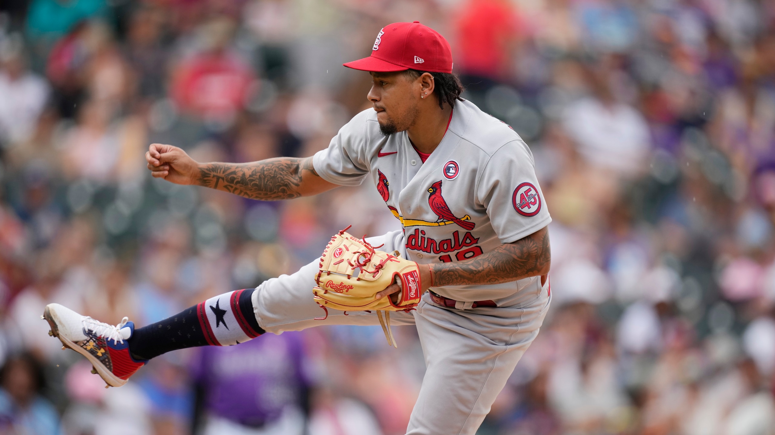 St. Louis Cardinals starting pitcher Carlos Martinez (18) in the fourth inning of a baseball game Sunday, July 4, 2021 in Denver. (AP Photo/David Zalubowski)