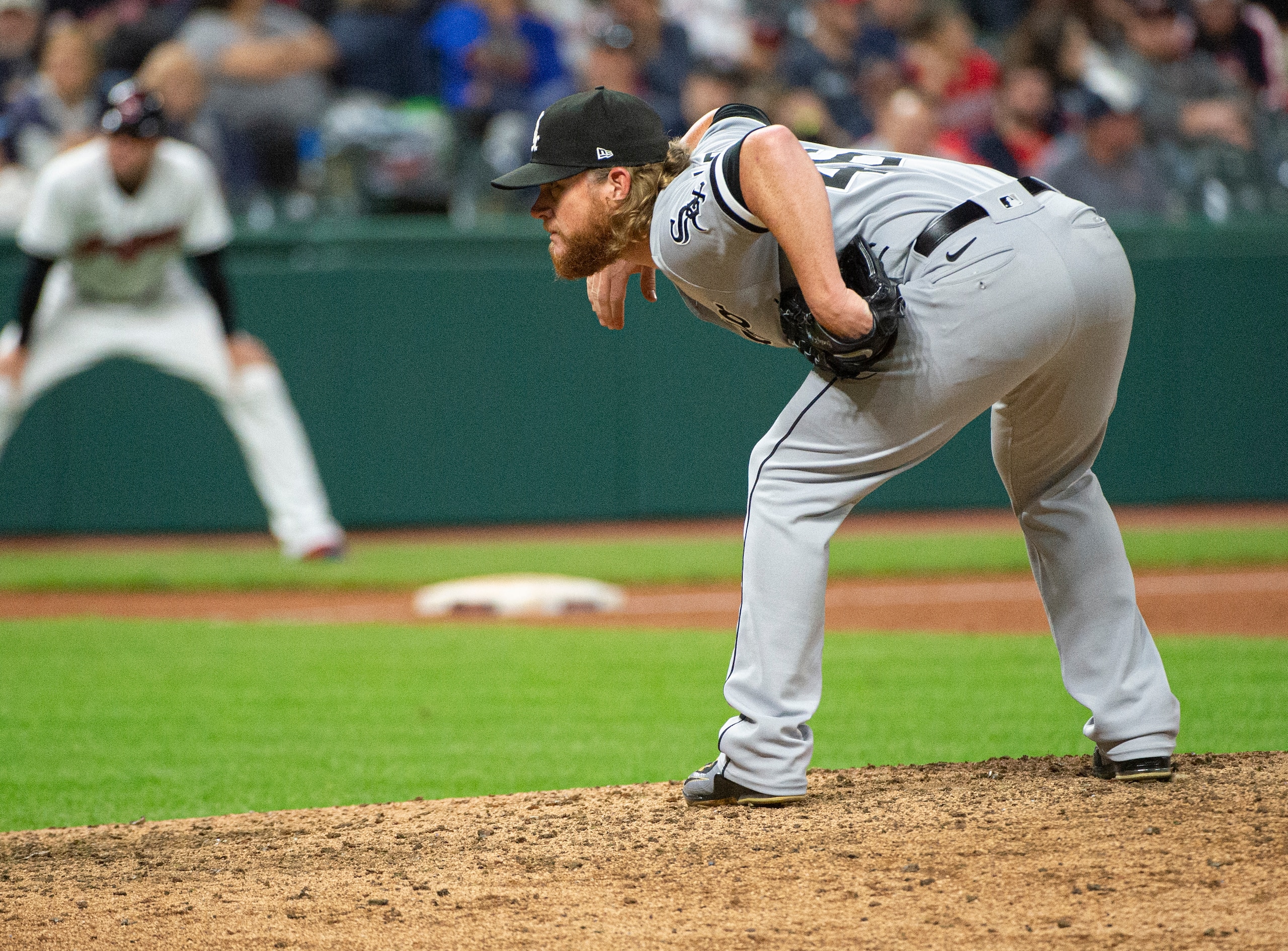 Chicago White Sox relief pitcher Craig Kimbrel looks for a sign during a baseball game against the Cleveland Indians in Cleveland, Friday, Sept. 24, 2021. (AP Photo/Phil Long)