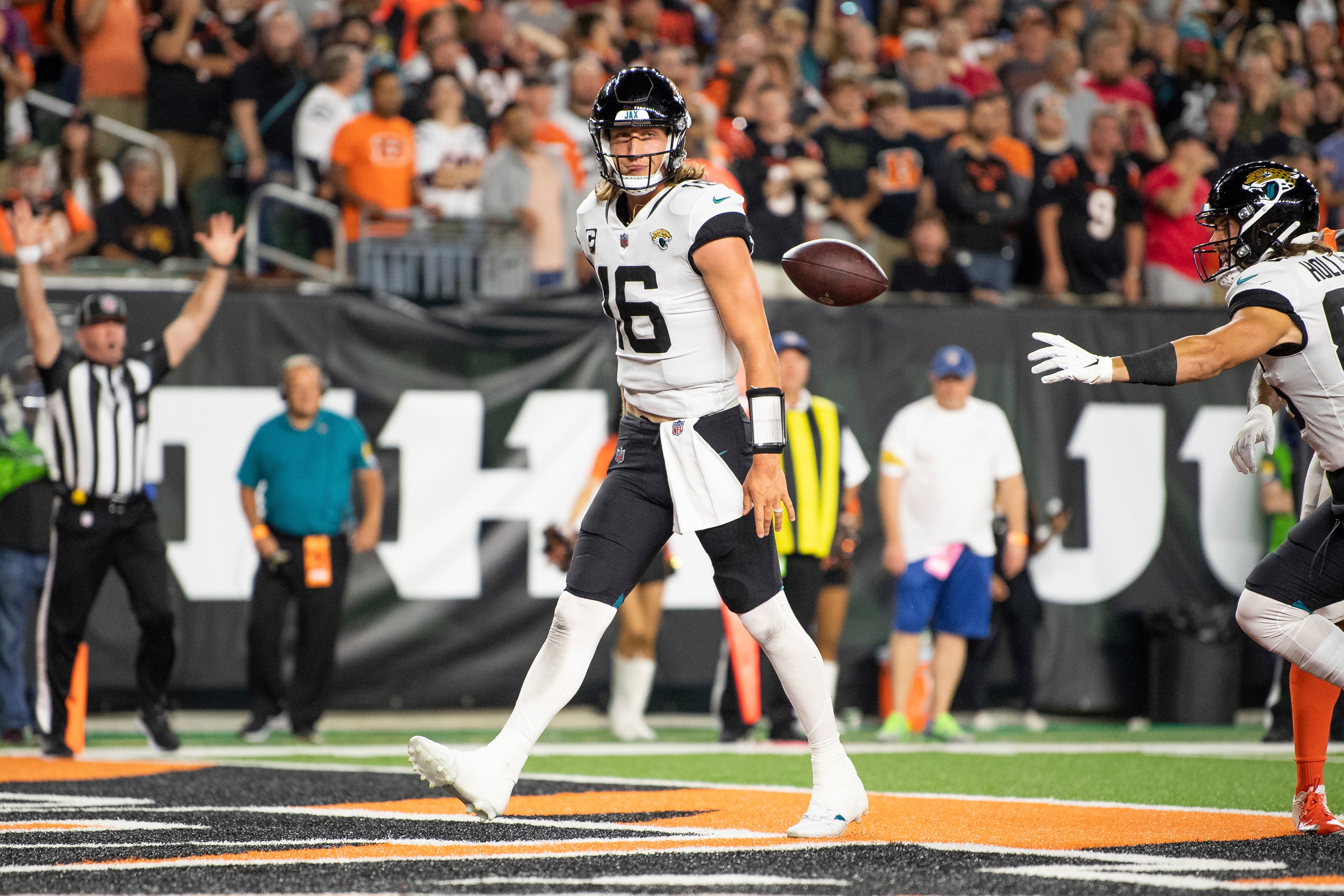 Jacksonville Jaguars quarterback Trevor Lawrence (16) celebrates a touchdown during an NFL football game against the Cincinnati Bengals, Thursday, Sept. 30, 2021, in Cincinnati. (AP Photo/Zach Bolinger)