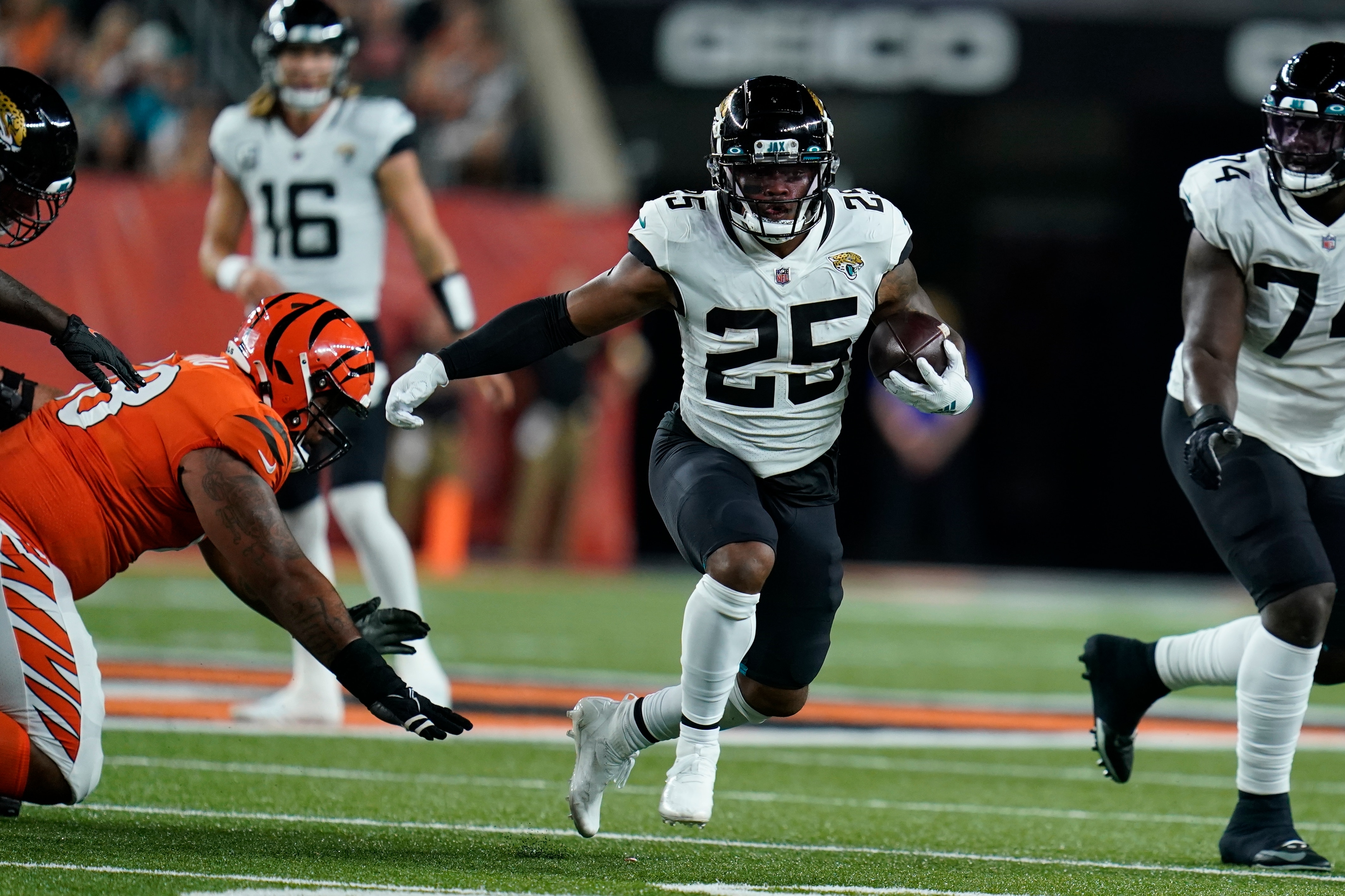 Jacksonville Jaguars' James Robinson (25) runs during the first half of an NFL football game against the Cincinnati Bengals, Thursday, Sept. 30, 2021, in Cincinnati. (AP Photo/Michael Conroy)