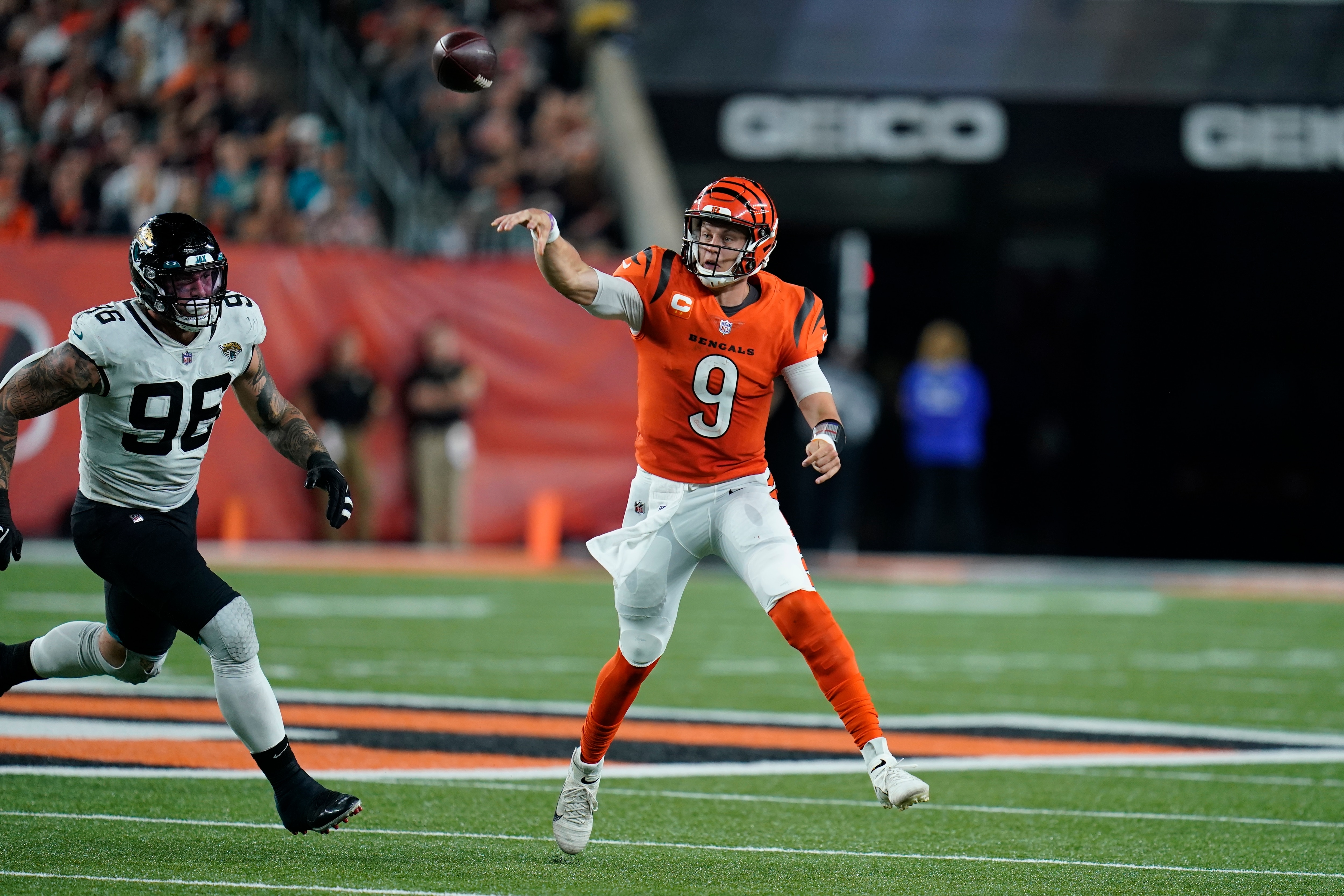 Cincinnati Bengals quarterback Joe Burrow (9) throws during the second half of an NFL football game against the Jacksonville Jaguars, Thursday, Sept. 30, 2021, in Cincinnati. (AP Photo/Michael Conroy)