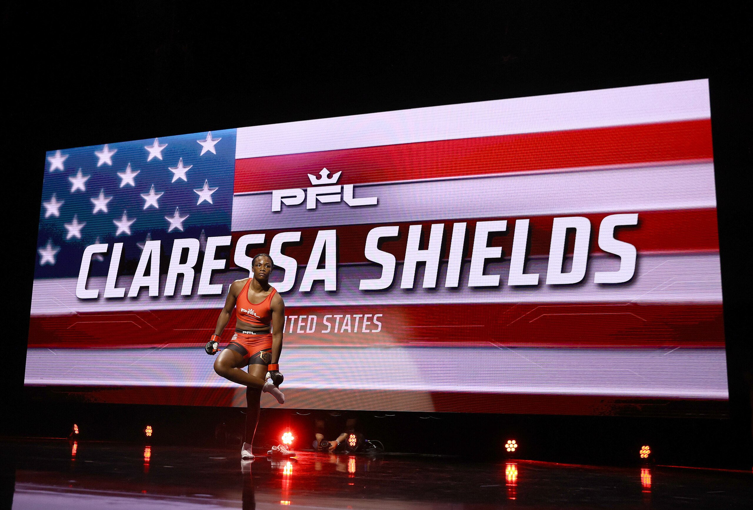 ATLANTIC CITY, NEW JERSEY - JUNE 10: Claressa Shields of the United States takes her socks off as she makes her entrance before her debut bout with Brittney Elkin of the United States during the lightweight division in Ovation Hall at Ocean Casino Resort on June 10, 2021 in Atlantic City, New Jersey. (Photo by Elsa/Getty Images)