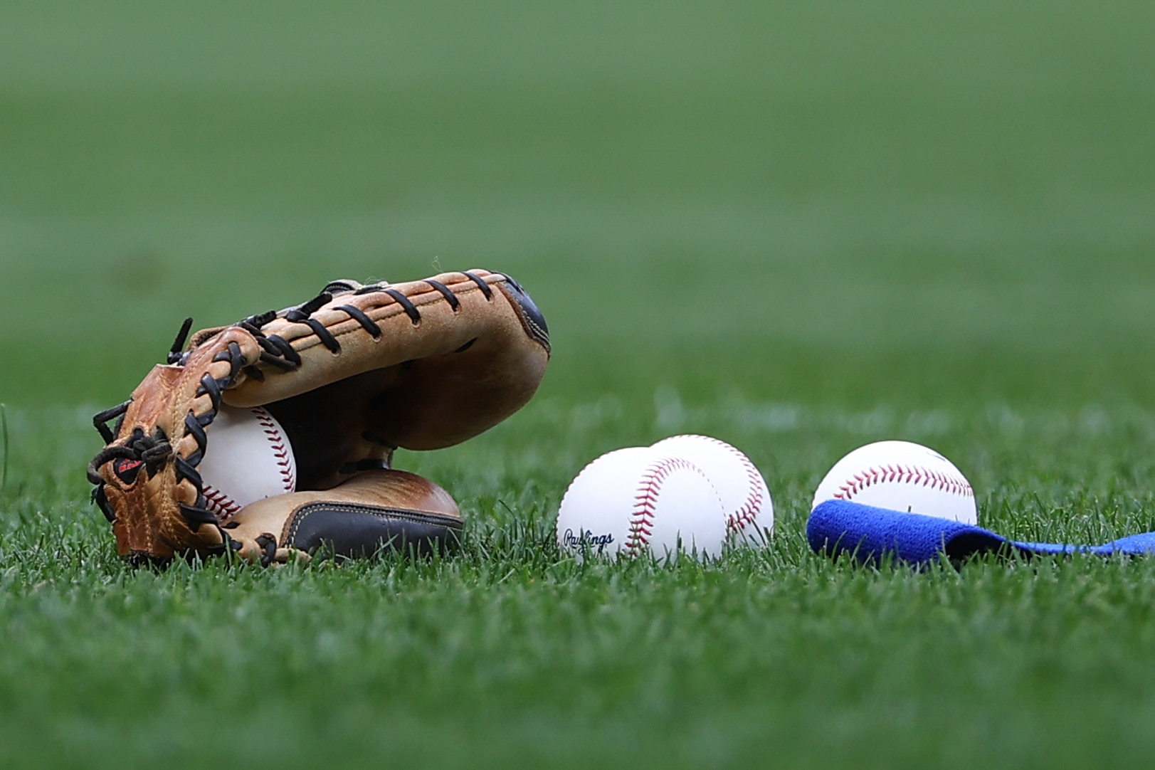 PHILADELPHIA, PA - AUGUST 07:  A general view of a glove and baseballs on the field prior to the Major League Baseball game between the Philadelphia Phillies and the New York Mets on August 7, 2021 at Citizens Bank Ballpark in Philadelphia, PA.  (Photo by Rich Graessle/Icon Sportswire via Getty Images)