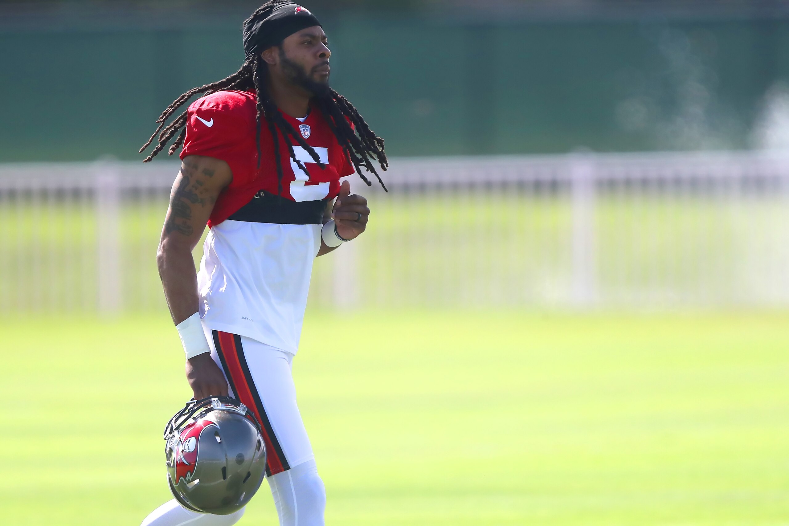 TAMPA, FL - SEP 29: Newly signed Tampa Bay Buccaneers defensive back Richard Sherman (5) trots onto the field during the Tampa Bay Buccaneers work out on September 29, 2021 at the AdventHealth Training Center at One Buccaneer Place in Tampa, Florida. (Photo by Cliff Welch/Icon Sportswire via Getty Images)
