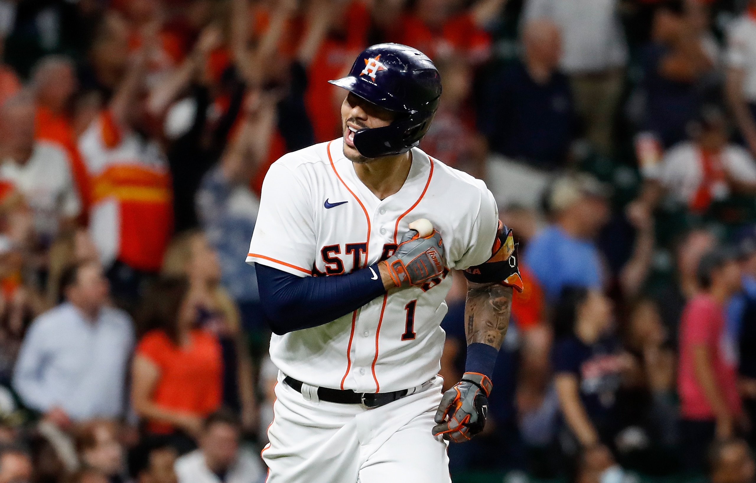 HOUSTON, TEXAS - SEPTEMBER 30: Carlos Correa #1 of the Houston Astros hits a three run home run in the fourth inning against the Tampa Bay Rays at Minute Maid Park on September 30, 2021 in Houston, Texas. (Photo by Tim Warner/Getty Images)