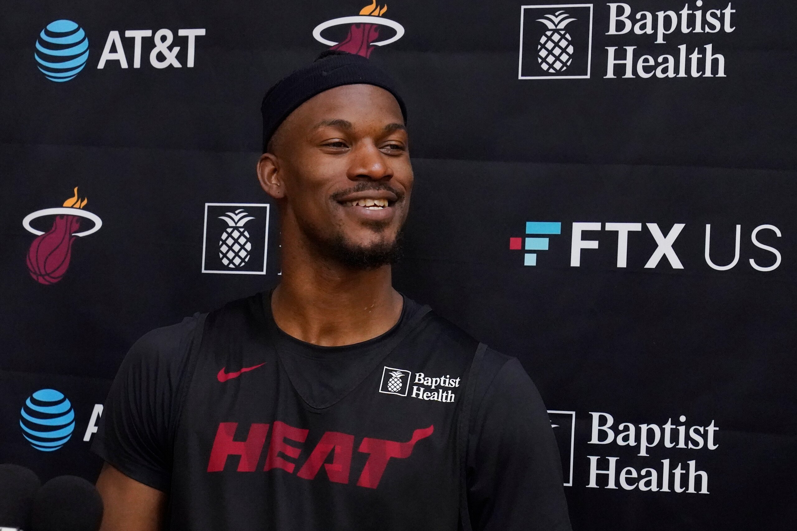 Miami Heat forward Jimmy Butler smiles as he talks to members of the media after practice during NBA Camp, Tuesday, Sept. 28, 2021, in Miami. (AP Photo/Wilfredo Lee)